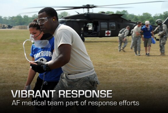 U.S. Air Force medical personnel assigned to Expeditionary Medical Support escort simulated injured patients away from an Army HH-60M Black Hawk helicopter during a medical evacuation in support of exercise Vibrant Response 13 at Contingency Operating Location Nighthawk at Camp Atterbury, Ind., July 30, 2012. Vibrant Response is a U.S. Northern Command-sponsored field training exercise for chemical, biological, radiological, nuclear and high-yield explosive consequence management forces designed to improve their ability to respond to catastrophic incidents. (U.S. Air Force photo by Tech. Sgt. Tony Tolley/Released)