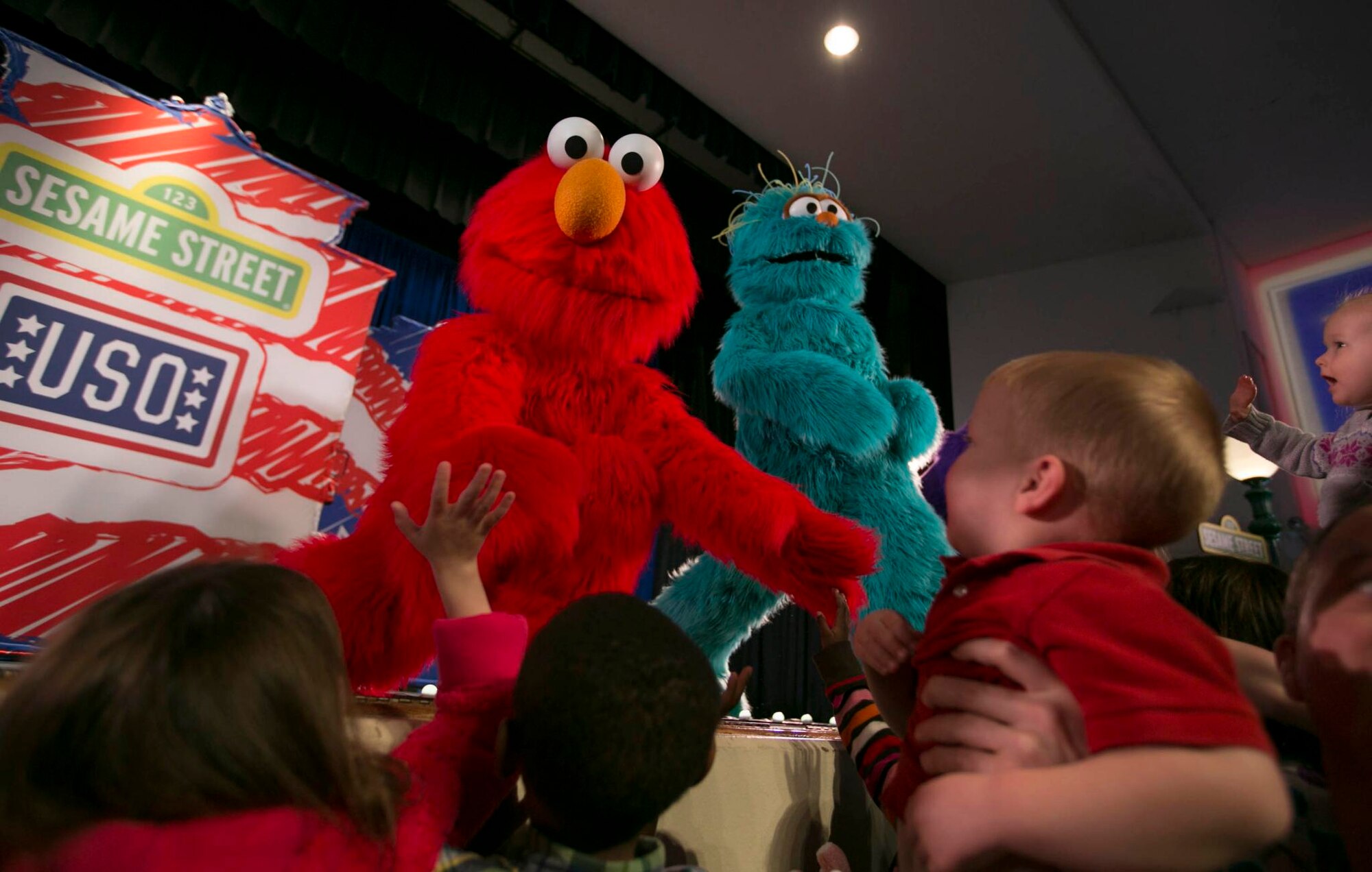 Elmo and Rosita greet servicemembers and their children during The Sesame Street/USO Experience for Military Families which kicked off April 7, 2012 at Scott Air Force Base, Ariz. (USO Photo by Fred Greaves)
