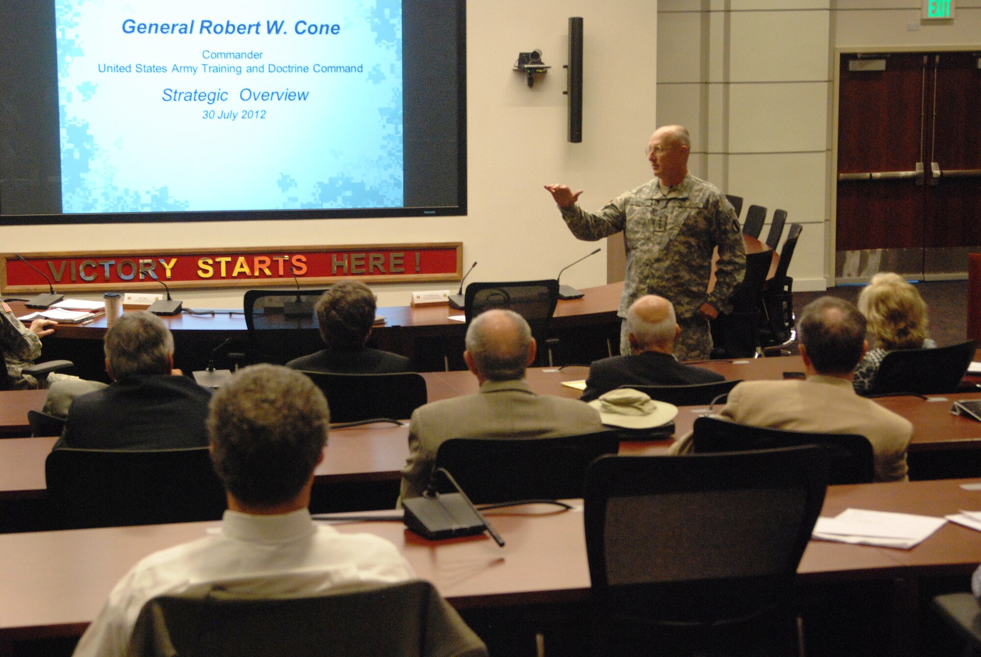 U.S. Army Gen. Robert W. Cone, commanding general of Training and Doctrine Command, shares TRADOC's overview to members of the Defense Orientation Conference Association at Morelli auditorium July 30. The group of 55 national business leaders, educators and members of the media spent the remainder of the afternoon touring the Transportation School simulation training center and the 128th Aviation Brigade's attack-helicopter training facility. (US Army photo by Sgt. 1st Class Kelly Jo Bridgwater/Released)