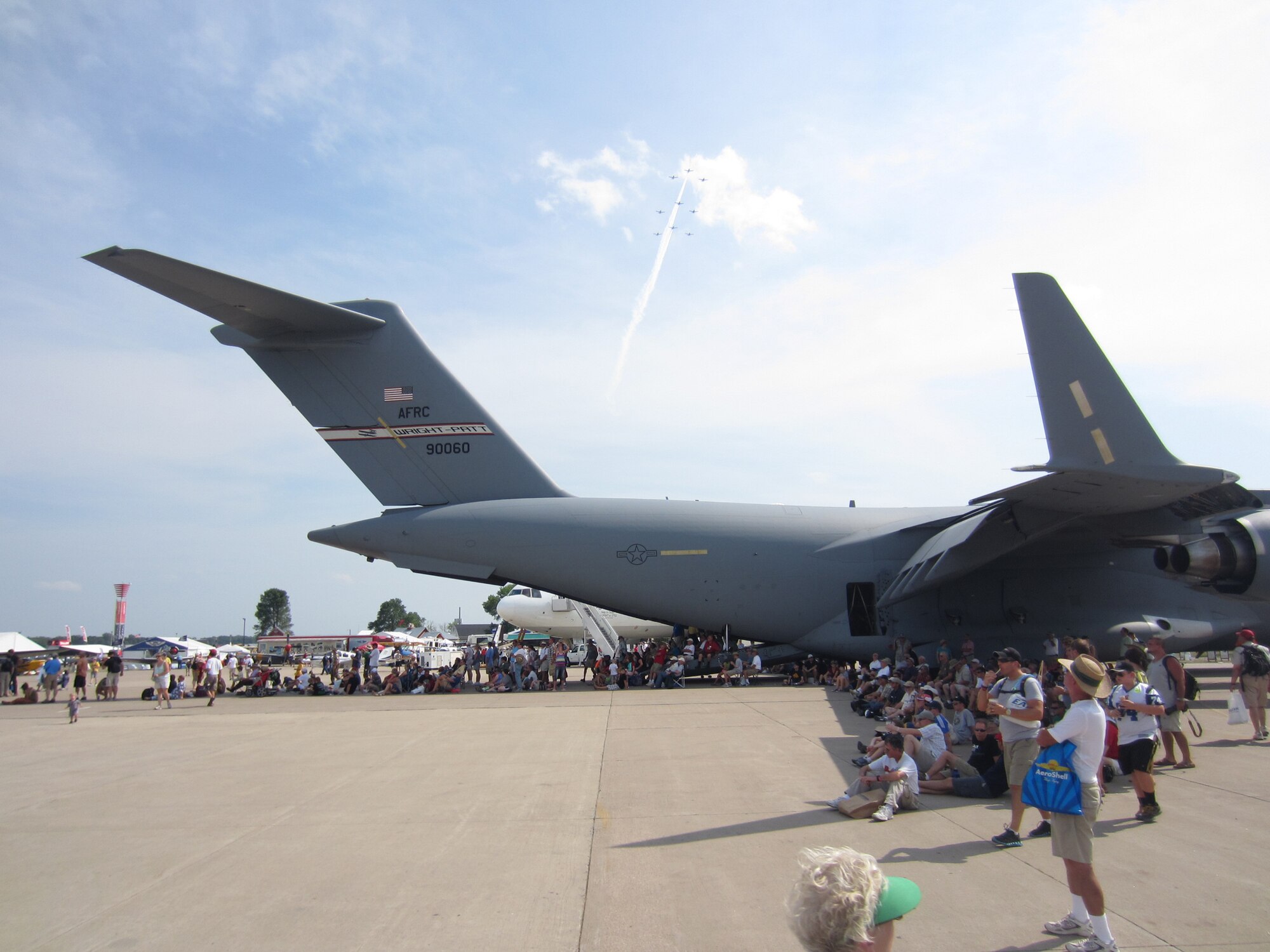 WRIGHT-PATTERSON AIR FORCE BASE, Ohio – A 445th Airlift Wing C-17 Globemaster III provides shade to aviation enthusiasts attending the 2012 Experimental Aircraft Association  (EAA) AirVenture at Wittman Regional Airport, Oshkosh, Wis., July 24. The wing displayed its mission capabilities to more than 500,000 attendees.
The crew providing the aircraft and support from the wing for the two-day event included two pilots and two loadmasters from the 89th Airlift Squadron, two flying crew chiefs from the 445th Aircraft Maintenance Squadron and a nurse and medical technician from the 445th Aeromedical Evacuation Squadron. (U.S. Air Force photo/Lt. Col. Richard Klarich)
