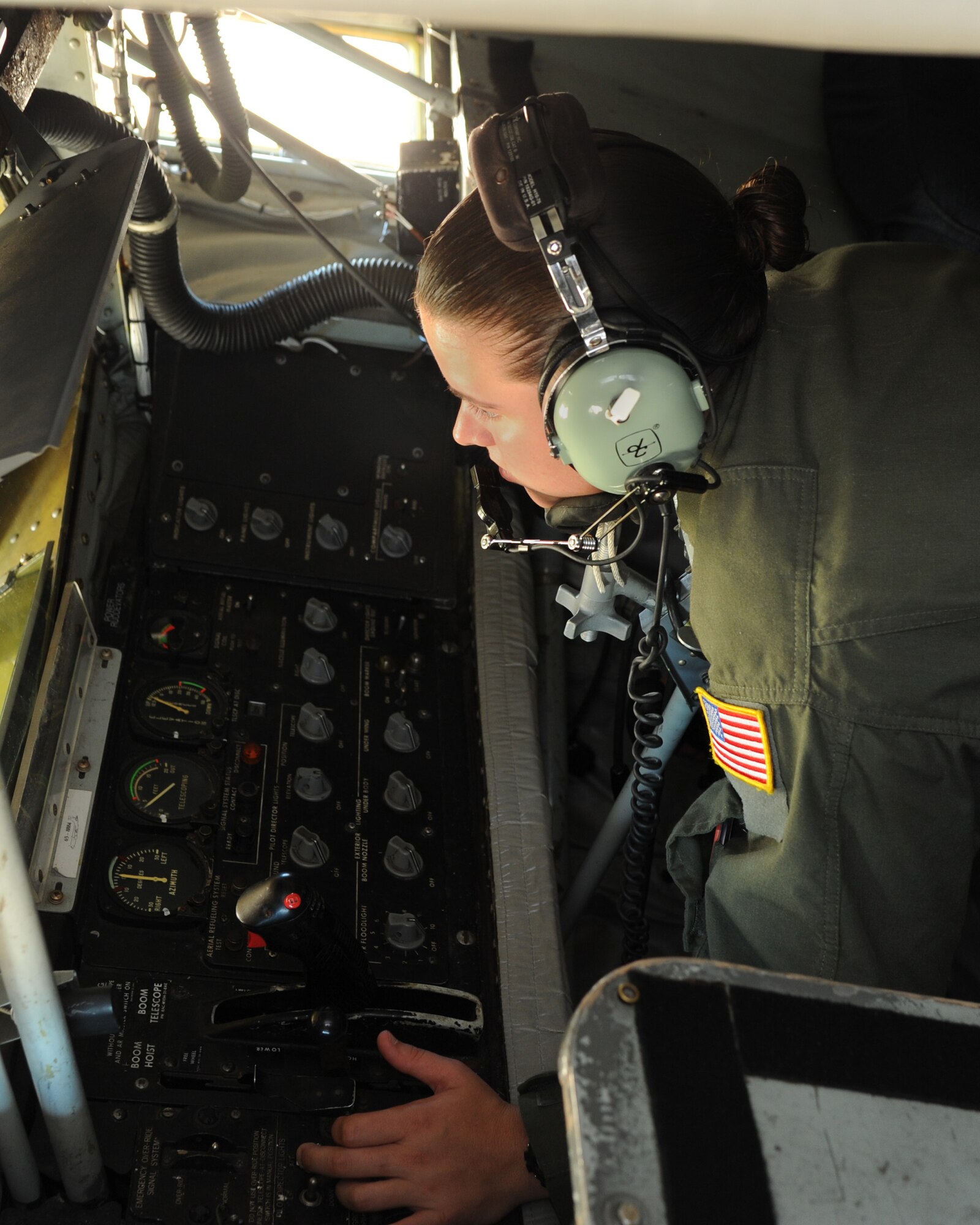 ALTUS AIR FORCE BASE, Okla. – Airman 1st Class Kayla Whorley, 97th Training Squadron boom operator student, simulates air refueling in the boom pod of a KC-135 Stratotanker on the base flight line, July 19, 2012. Whorley was inspired to follow the footsteps of her grandfather, Chief Master Sgt. (ret.) Ted Whorley, who was a boom operator from 1970-1997. (U.S. Air Force photo by Airman 1st Class Klynne Pearl Serrano / 97th Air Mobility Wing / Released)