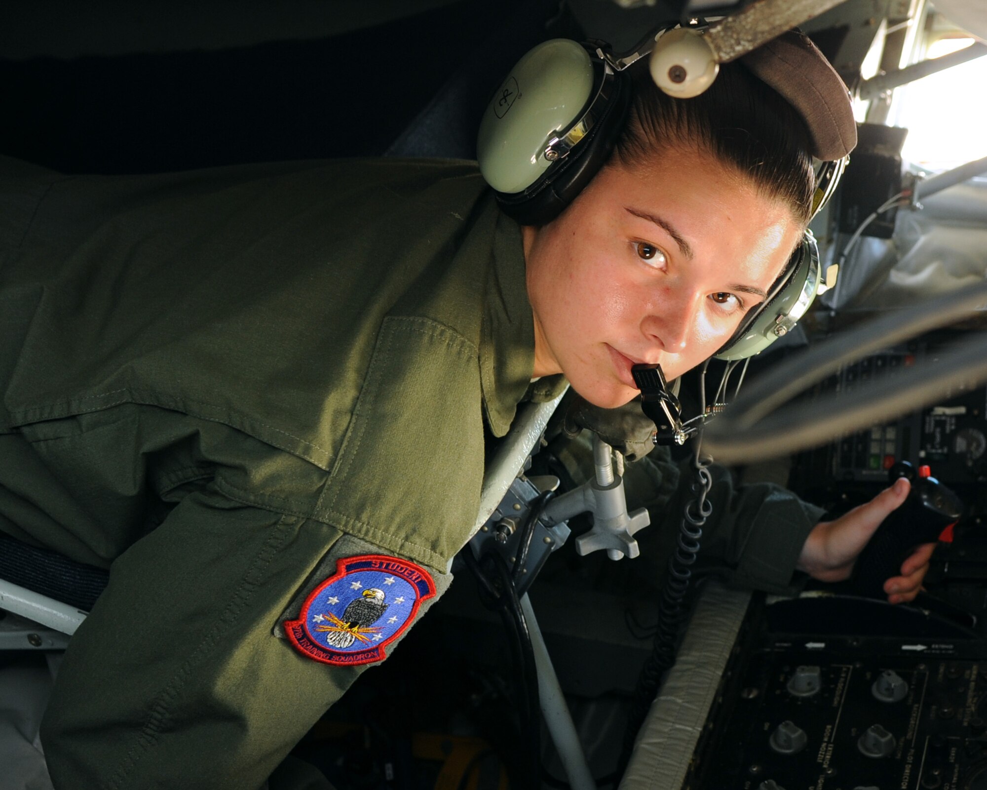 ALTUS AIR FORCE BASE, Okla. – Airman 1st Class Kayla Whorley, 97th Training Squadron boom operator student, simulates air refueling in the boom pod of a KC-135 Stratotanker on the base flight line, July 19, 2012. Whorley was inspired to follow the footsteps of her grandfather, Chief Master Sgt. (ret.) Ted Whorley, who was a boom operator from 1970-1997. (U.S. Air Force photo by Airman 1st Class Klynne Pearl Serrano / 97th Air Mobility Wing / Released)