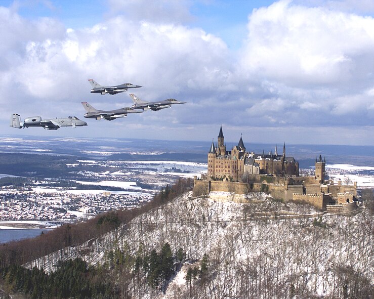U.S. Air Force F-16 Fighting Falcons fly above Burg Hohenzollern, located atop Mount Hohenzollern in Baden-Wuerttemberg. The castle is open for tours throughout the year. For more information, visit http://www.burg-hohenzollern.com/startseite.html. (U.S. Air Force courtesy photo/Released).