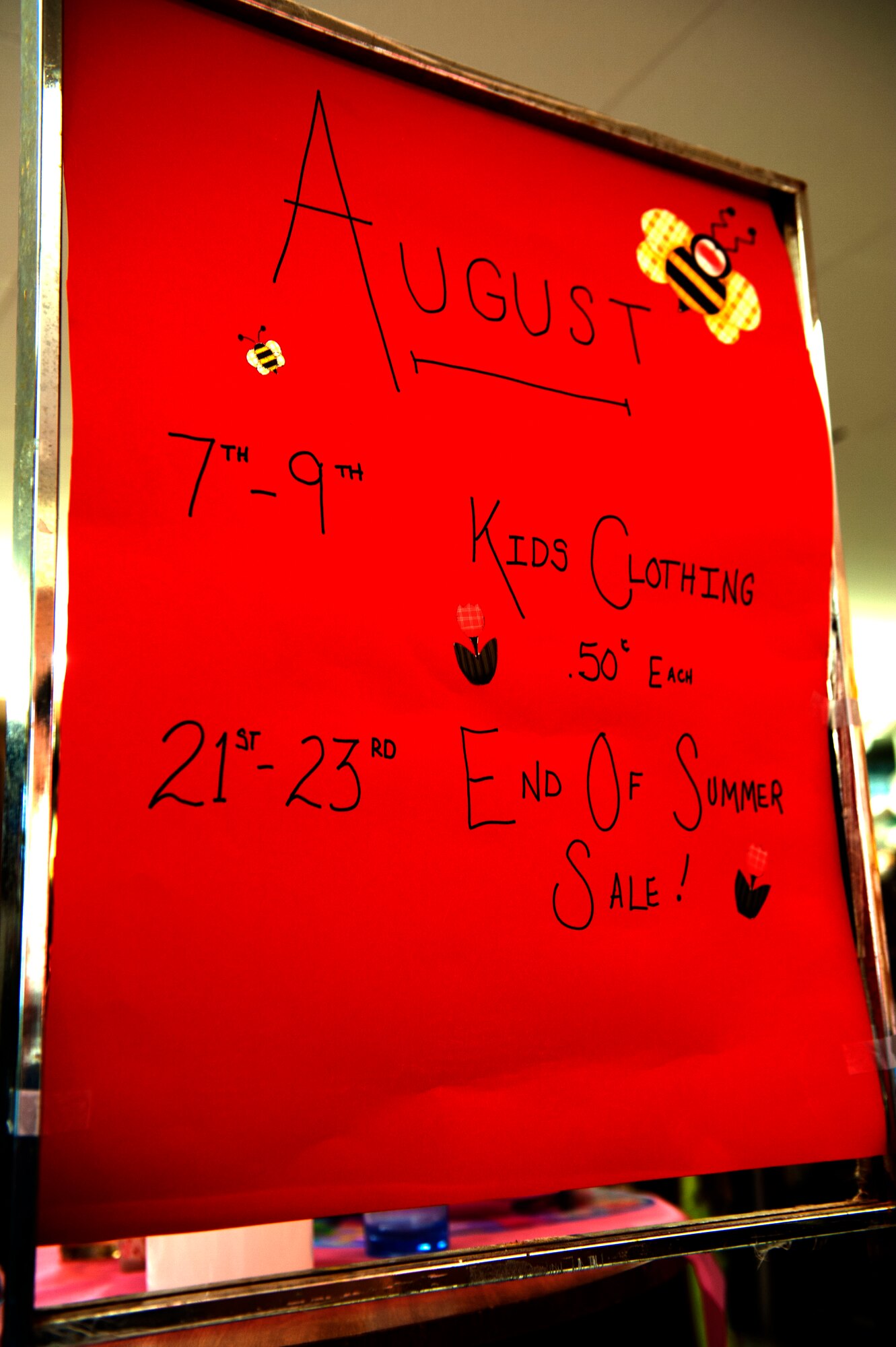SPANGDAHLEM AIR BASE, Germany – An end of summer sale advertisement is posted inside the Spangdahlem Spouses and Enlisted Member’s Club Thrift Shop here July 31.  All of the profits earned by the thrift shop are returned to the community through the spouse’s club. The shop is open 11 a.m. - 5 p.m. Tuesday through Thursday and the last Saturday of each month. For more information, call DSN 452-2243 or 06565-61-2243. (U.S. Air Force photo by Airman 1st Class Gustavo Castillo/Released)