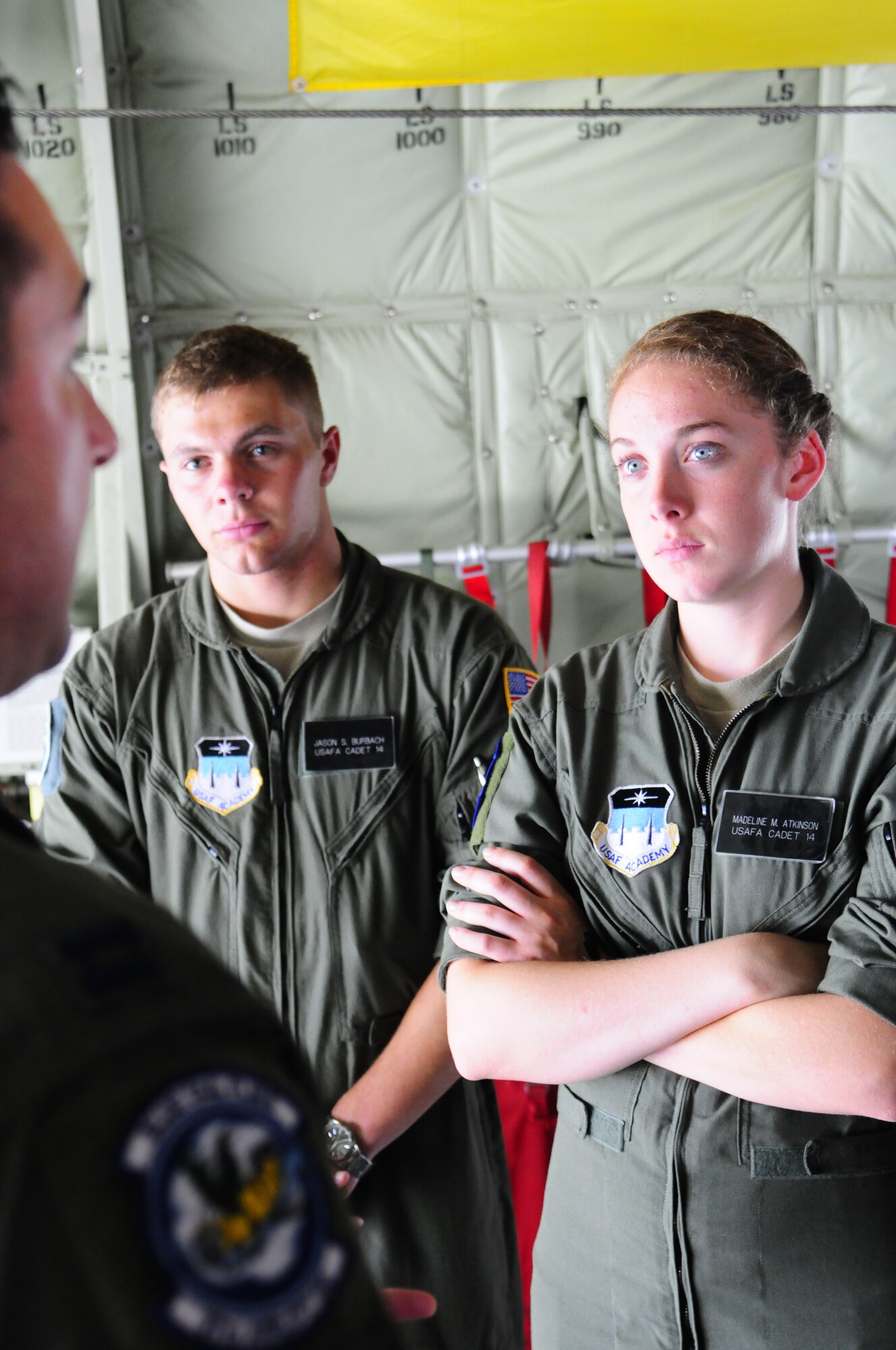 Cadet 2nd Class Jason Burbach (left) and Cadet 2nd Class Madeline Atkinson (right), both Air Force Academy cadets, listen as Capt. Kevin Coughlin 37th Airlift Squadron pilot gives them a tour of the C-130J Super Hercules before an incentive flight as a part of the Operation Air Force at Ramstein Air Base, Germany, July 25, 2012. Ops AF provides both USAFA and AF Reserve Officers’ Training Corps cadets experience in the operational Air Force while focusing on different areas of cadet development. (U.S. Air Force photo/Airman 1st Class Hailey Haux)