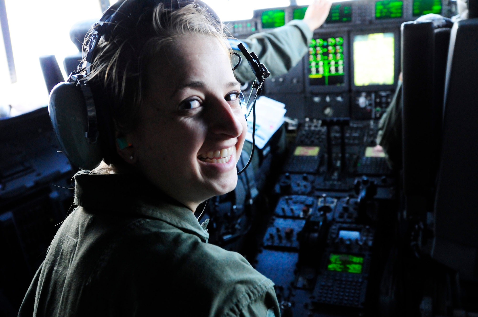 Cadet 2nd Class Brooke Badasar, Air Force Academy cadet, smiles as she gets to fly in the cockpit of a C-130J Super Hercules during an incentive flight as a part of the Operation Air Force at Ramstein Air Base, Germany, July 25, 2012. Ops AF provides both USAFA and AF Reserve Officers’ Training Corps cadets experience in the operational Air Force while focusing on different areas of cadet development. (U.S. Air Force photo/Airman 1st Class Hailey Haux)