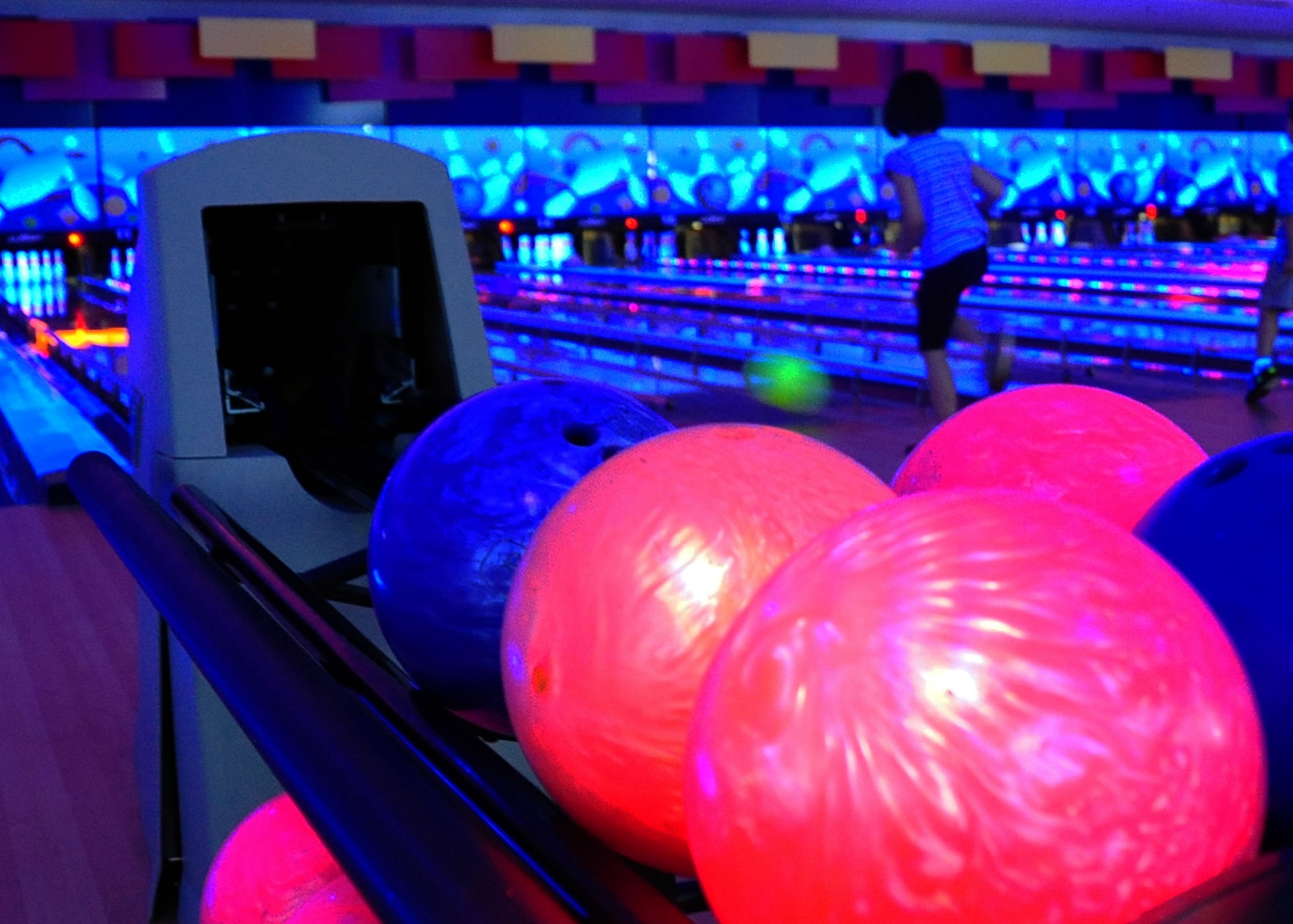Mattie Watkins, 6, daughter of U. S. Air Force Staff Sgt. Adam Watkins, 35th Comptroller Squadron financial manager, bowls down an alley at the Walmsley Bowling Center at Misawa Air Base, Japan, August 1, 2012.  The bowling center offers free bowling and shoe rentals, Monday through Thursday from 11 a.m. to 2 p.m. during the month of August.  (U.S. Air Force photo by Staff Sgt. April Quintanilla)