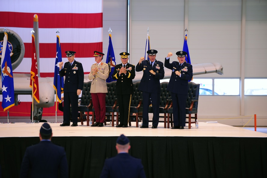 Air Force Chief of Staff Gen. Norton A. Schwartz, Gen. Sir Richard Shirreff, Deputy Supreme Allied Commander, Europe, Gen. Carter F. Ham, U.S. Africa Command commander, to Gen. Mark A. Welsh III, outgoing U.S. Air Forces in Europe commander and Gen. Philip M. Breedlove, the commander of U.S. Air Forces in Europe sing the Air Force song during the change of command ceremony on Ramstein Air Base, Germany, July 31, 2012. Gen. Mark A. Welsh III, outgoing USAFE commander, relinquished command during the change of command ceremony after providing command and control for air, space and missile defense for activities in an area of operations covering almost one-fifth of the globe which included 51 countries in Europe, Asia, the Middle East, and the Arctic and Atlantic oceans. (U.S. Air Force photo/Airman 1st Class Kendra Alba)