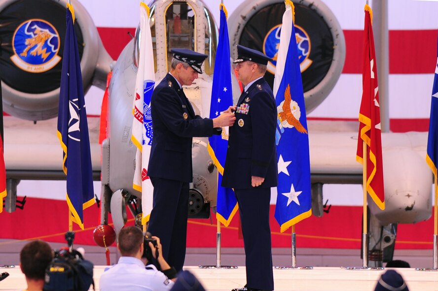 Air Force Chief of Staff Gen. Norton Schwartz presents Gen. Mark A. Welsh III with the Defense Distinguished Service Medal during a change of command ceremony at Ramstein Air Base, Germany, July 31, 2012. During the ceremony, Welsh relinquished command after providing command and control for air, space and missile defense of activities in an area of operations covering almost one-fifth of the globe, which includes 51 countries in Europe, Asia, the Middle East, and the Arctic and Atlantic oceans. (U.S. Air Force photo/Airman 1st Class Kendra Alba)