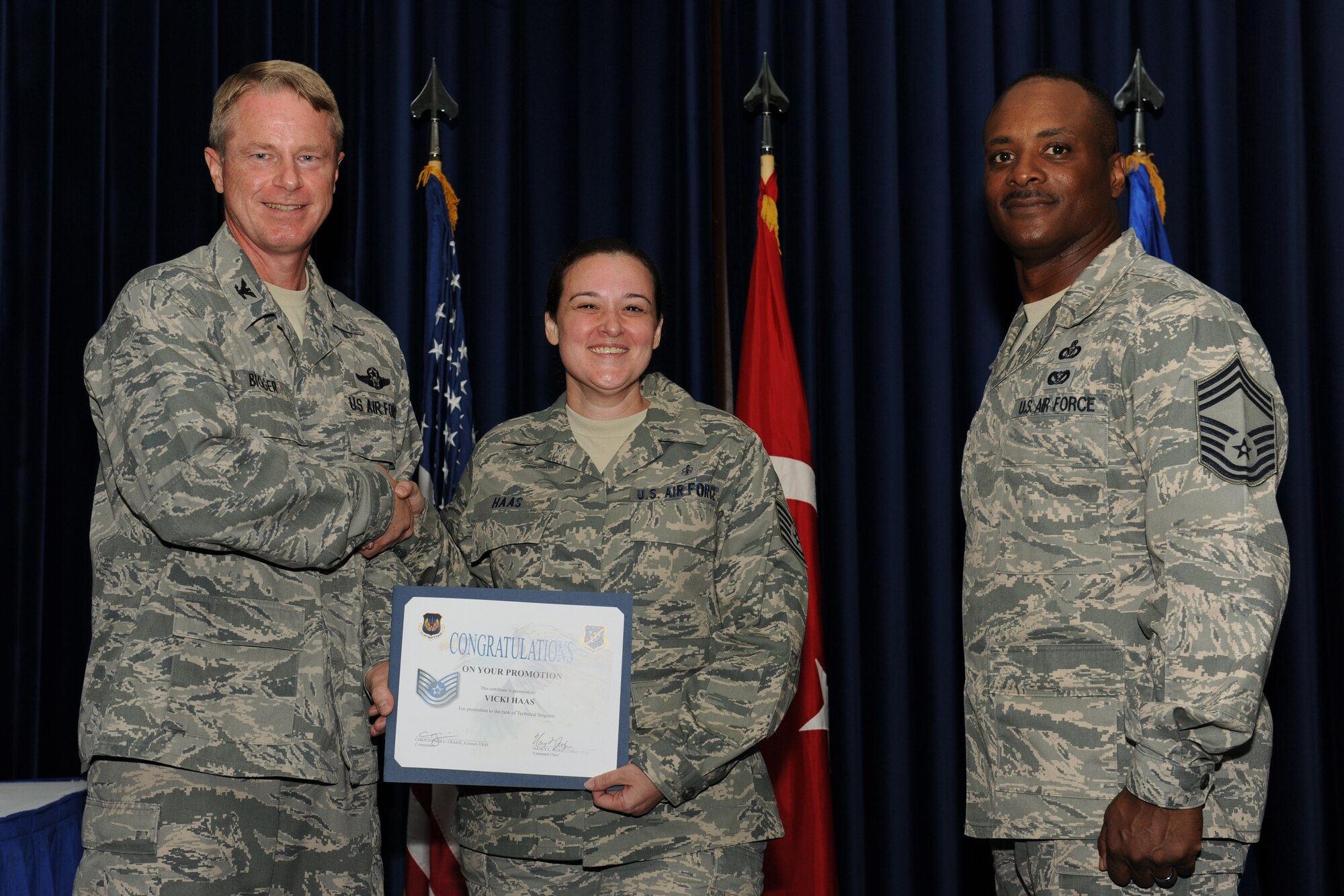 Vicki Hass, 39th Medical Operations Squadron, is promoted to the rank of technical sergeant July 31, 2012, at the Club Complex ballroom at Incirlik Air Base, Turkey. (U.S. Air Force photo by Senior Airman Jarvie Z. Wallace/Released)