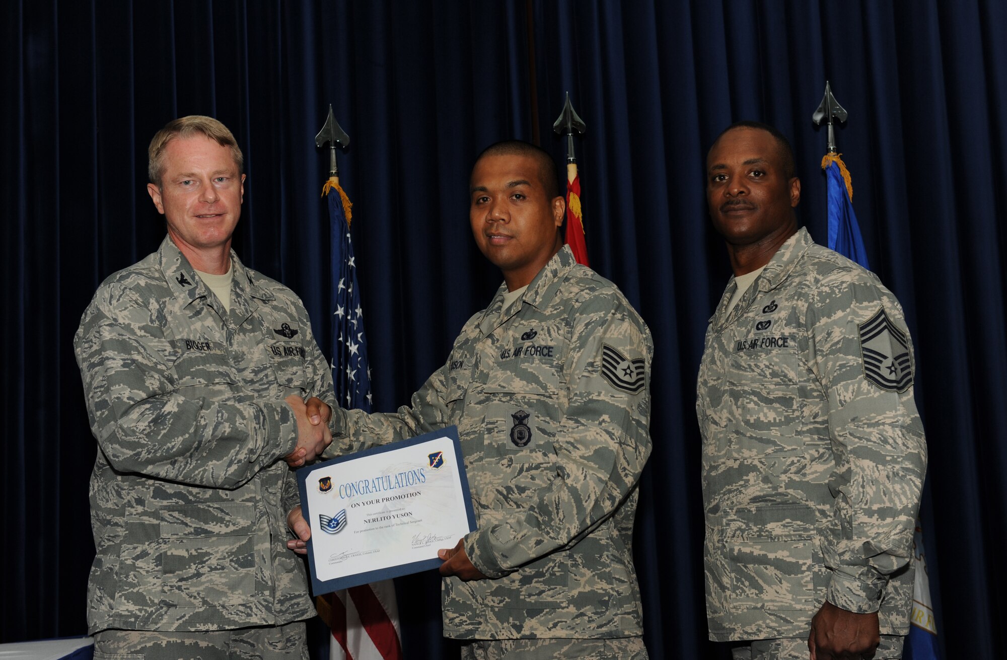 Nerlito Yuson, 39th Security Forces Squadron, is promoted to the rank of technical sergeant July 31, 2012, at the Club Complex ballroom at Incirlik Air Base, Turkey. (U.S. Air Force photo by Senior Airman Jarvie Z. Wallace/Released)