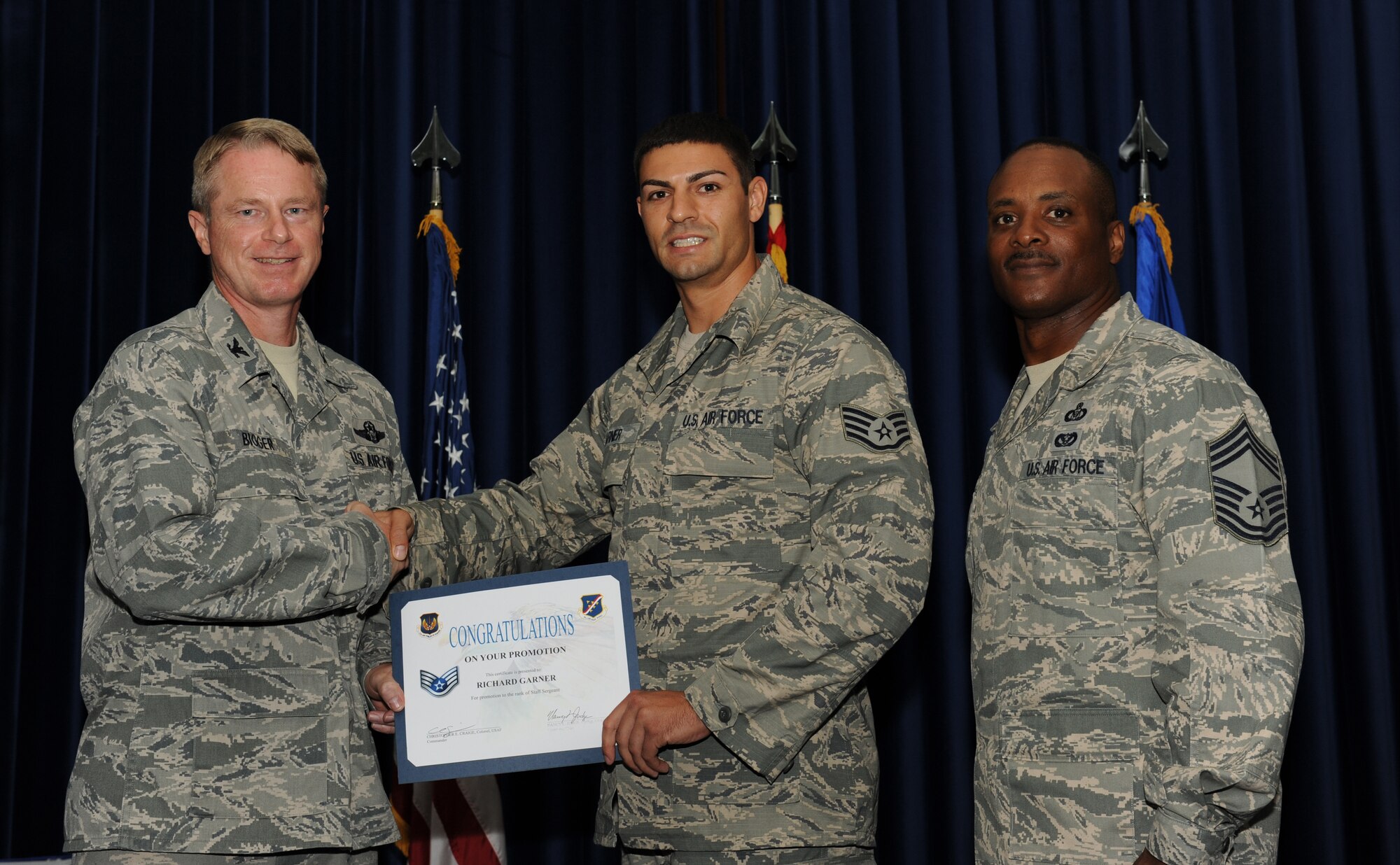 Richard Garner, 728th Air Mobilty Squadron, is promoted to the rank of staff sergeant July 31, 2012, at the Club Complex ballroom at Incirlik Air Base, Turkey. (U.S. Air Force photo by Senior Airman Jarvie Z. Wallace/Released)