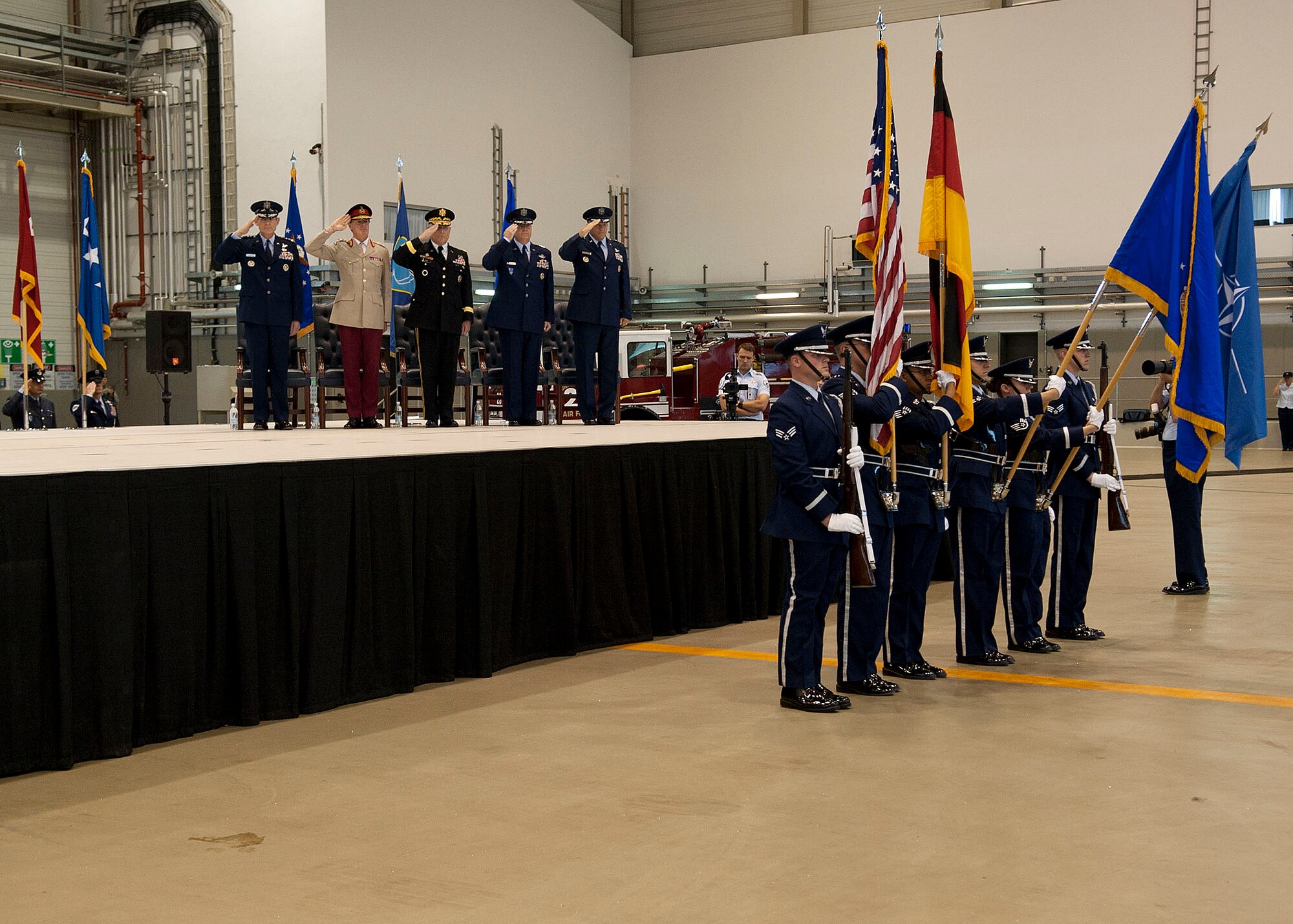 Air Force Chief of Staff Gen. Norton Schwartz; Gen. Sir Richard Shirreff, Deputy Supreme Allied Commander, Europe; Gen. Carter Ham, U.S. Africa Command commander; Gen. Mark A. Welsh III, outgoing U.S. Air Forces in Europe commander; and Gen. Philip Breedlove, the incoming USAFE commander, stand for the presentation of the colors during the change of command ceremony on Ramstein Air Base, Germany, July 31, 2012. During the ceremony, Welsh relinquished command after providing command and control for air, space and missile defense of activities in an area of operations covering almost one-fifth of the globe, which includes 51 countries in Europe, Asia, the Middle East, and the Arctic and Atlantic oceans. (U.S. Air Force photo/Staff Sgt. Daylena Gonzalez)