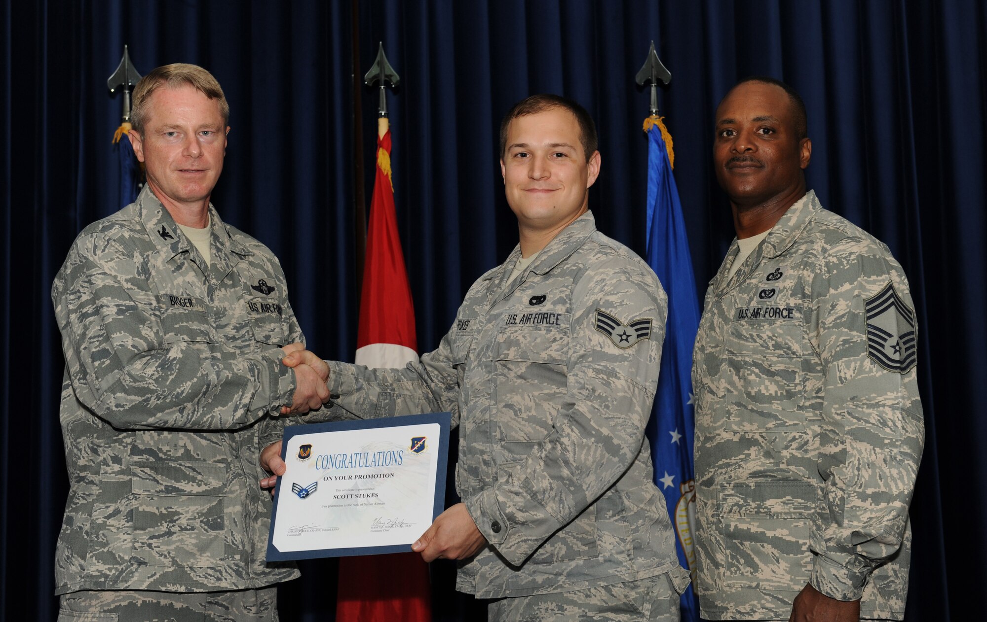 Scott Stukes, 728th Air Mobility Squadron, is promoted to the rank of senior airman July 31, 2012, at the Club Complex ballroom at Incirlik Air Base, Turkey. (U.S. Air Force photo by Senior Airman Jarvie Z. Wallace/Released)  