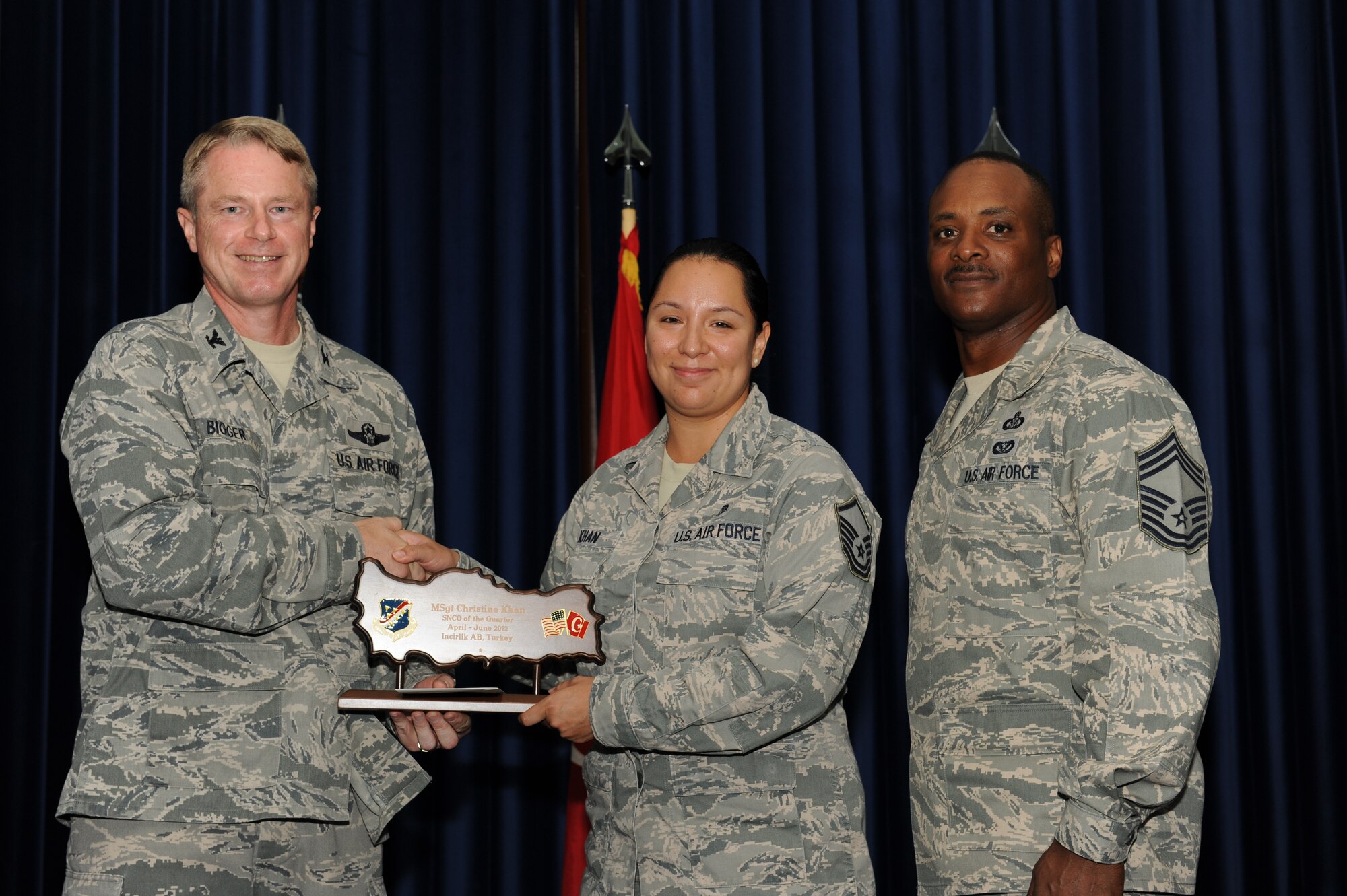 Master Sgt. Christine Khan, 39th Medical Operations Squadron, receives the 39th Air Base Wing senior NCO of the Quarter Award July 31, 2012, at the Club Complex ballroom at Incirlik Air Base, Turkey. (U.S. Air Force photo by Senior Airman Jarvie Z. Wallace/Released)