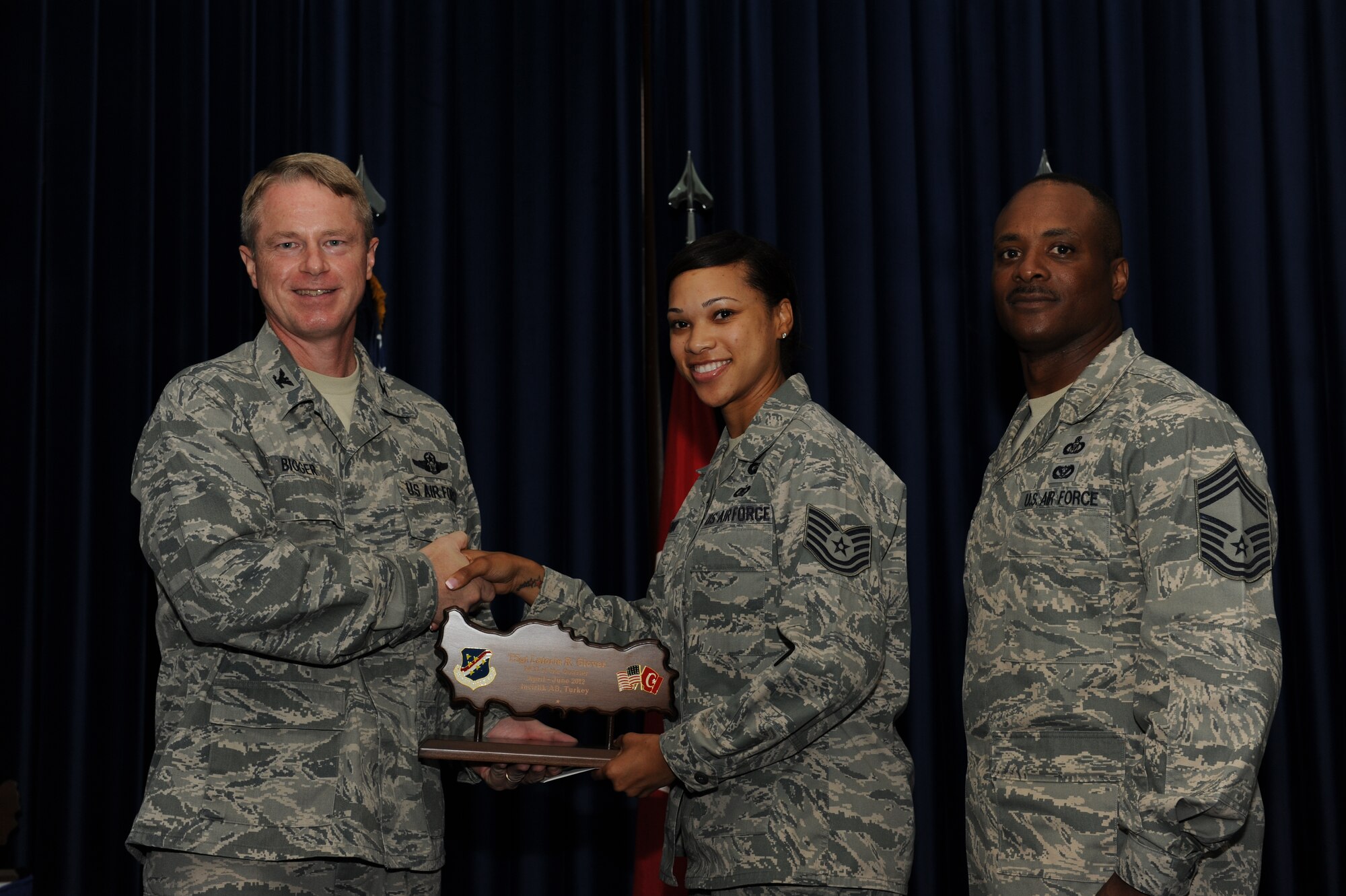 Tech. Sgt. Latoria Glover, 39th Contracting Squadron, receives the 39th Air Base Wing NCO of the Quarter Award July 31, 2012, at the Club Complex ballroom at Incirlik Air Base, Turkey. (U.S. Air Force photo by Senior Airman Jarvie Z. Wallace/Released)
