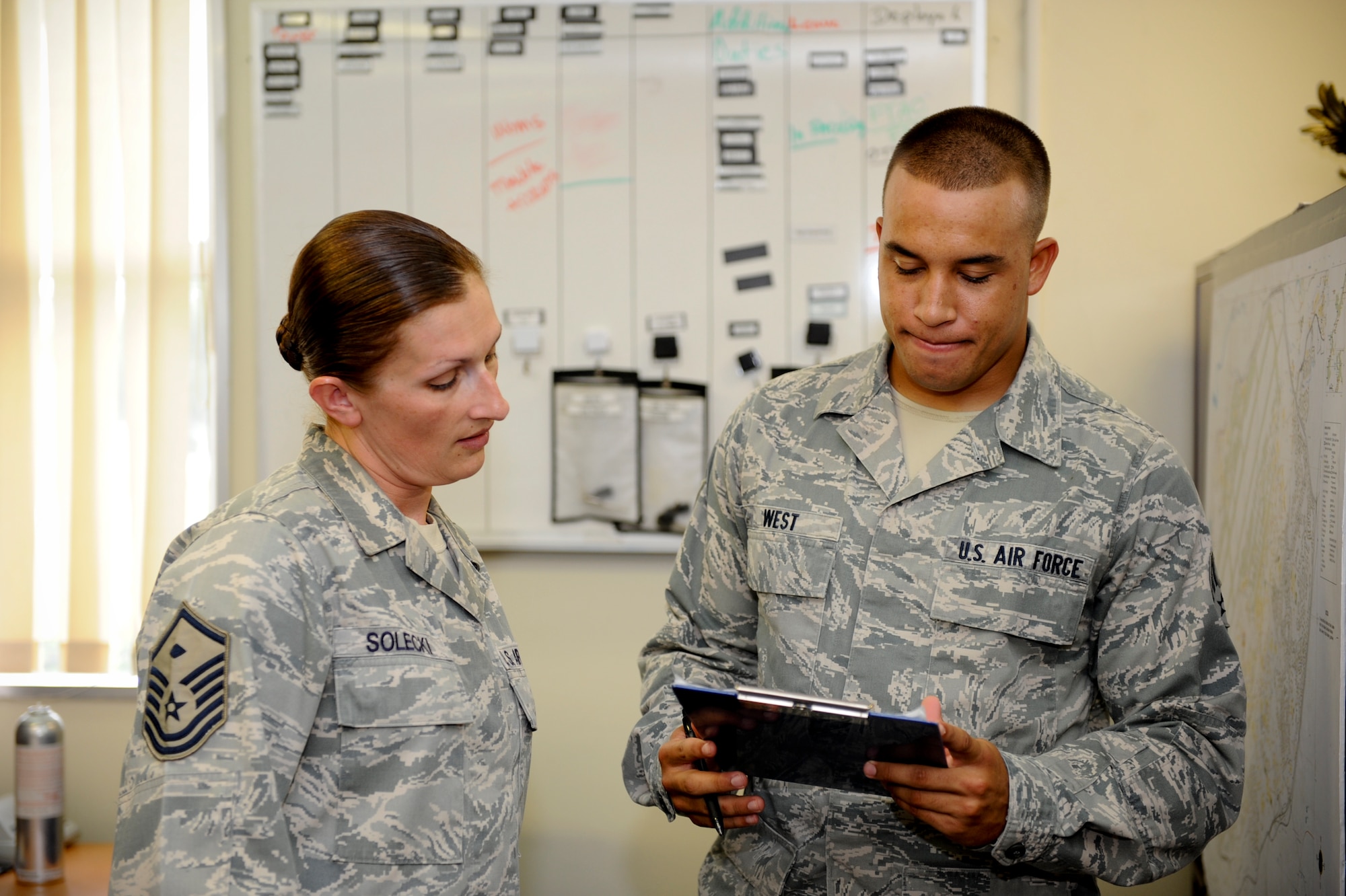 U.S. Air Force Master Sgt. Sara Soleki, 18th Communication Squadron first
sergeant, talks with Senior Airman Ottis West, 18th Communication Squadron
cable and antenna system technician, at Kadena Air Base, Japan on Aug. 1,
2012. Soleki visits her Airmen throughout her squadron on Wednesdays to ensure they
are being taken care of and to check in on them. (U.S. Air Force
photo/Airman 1st Class Brooke P. Beers)
