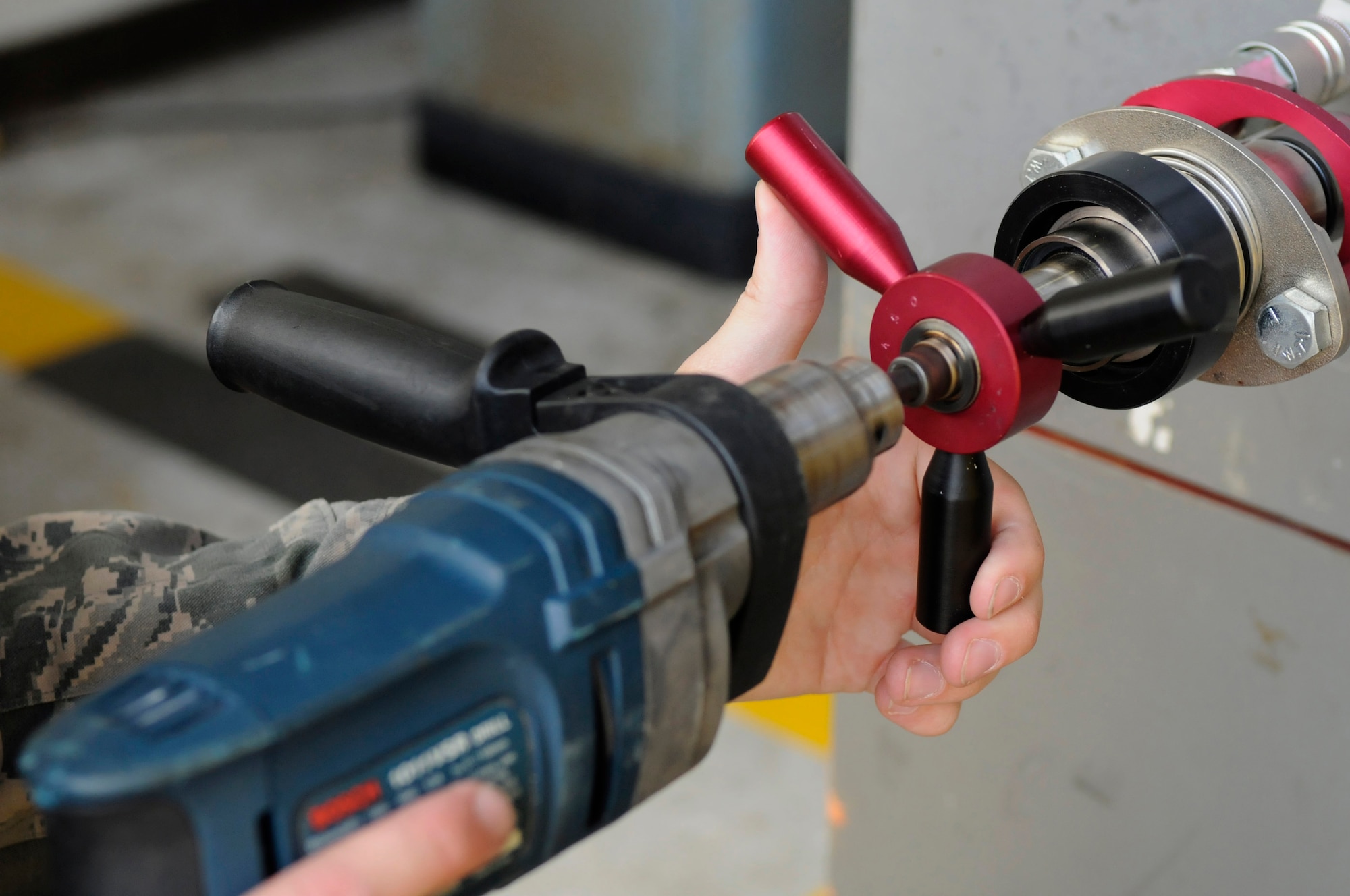 A safe is drilled open to identify any contents left by previous owners at the 18th Civil Engineer Squadron Lock Shop on Kadena Air Base, Japan, July 30, 2012. The locksmiths are in charge of base building keys, and they perform maintenance on any vaults, safes and similar security areas. (U.S. Air Force photo/Airman Tara A. Williamson)