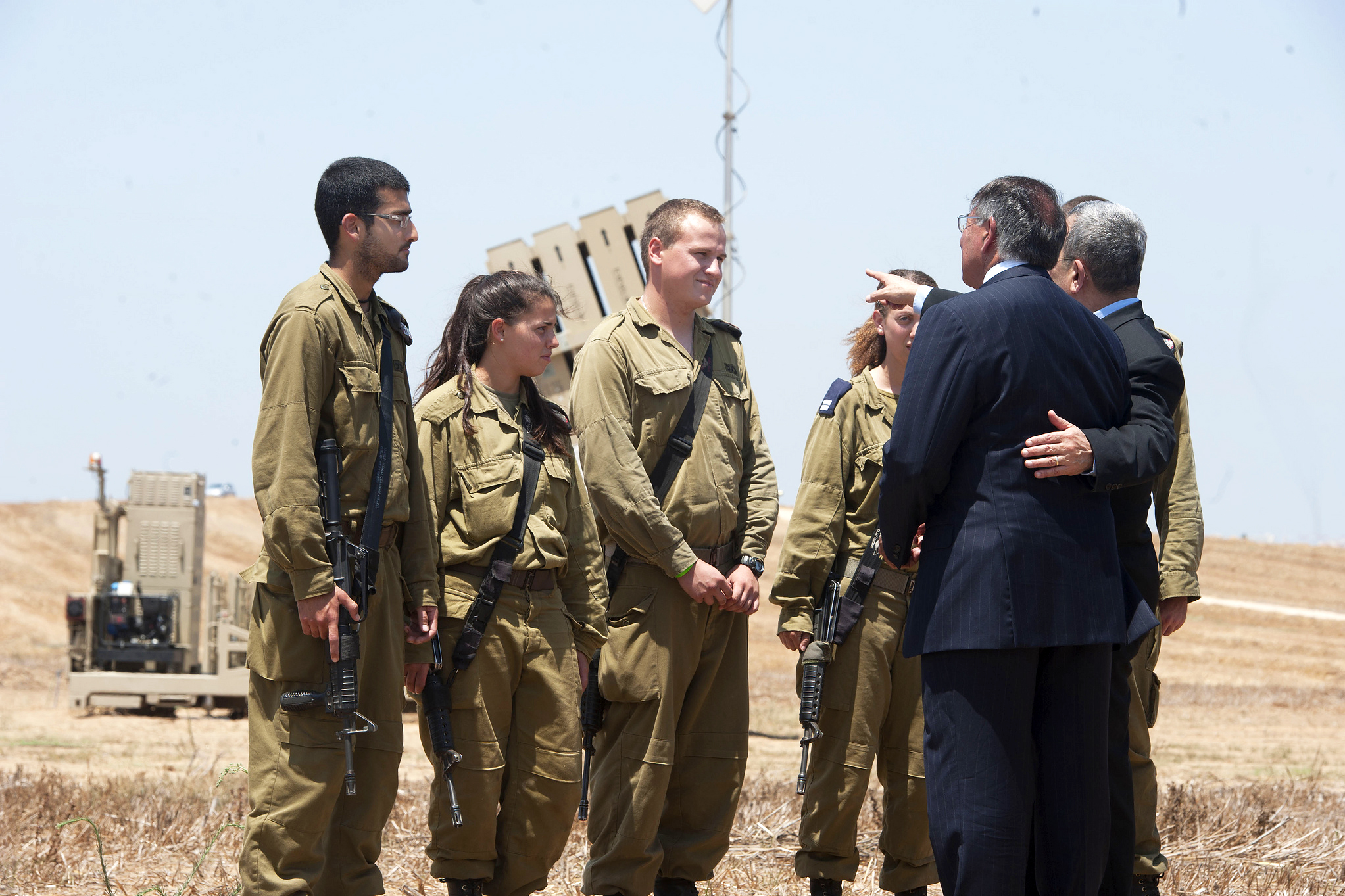 U.S. Defense Secretary Leon E. Panetta and Israeli Defense Minister Ehud  Barak speak with Israeli soldiers