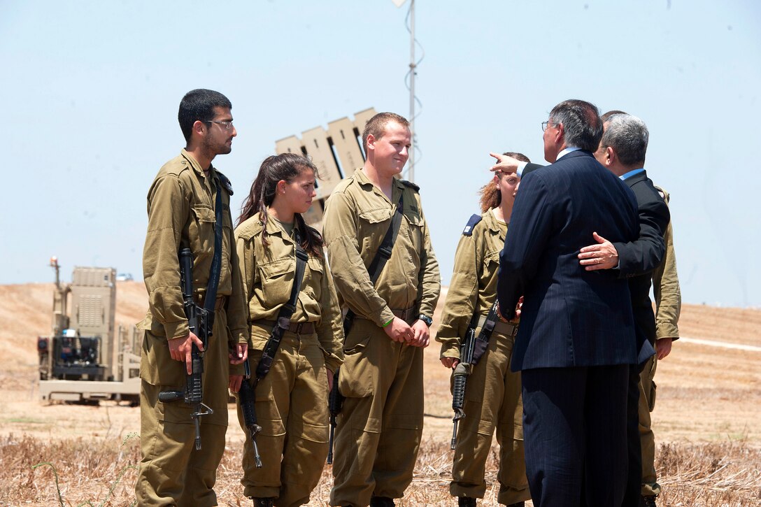 U.S. Defense Secretary Leon E. Panetta and Israeli Defense Minister Ehud Barak speak with Israeli soldiers at an Iron Dome anti-missile site in Ashkelon, Israel, Aug. 1, 2012.