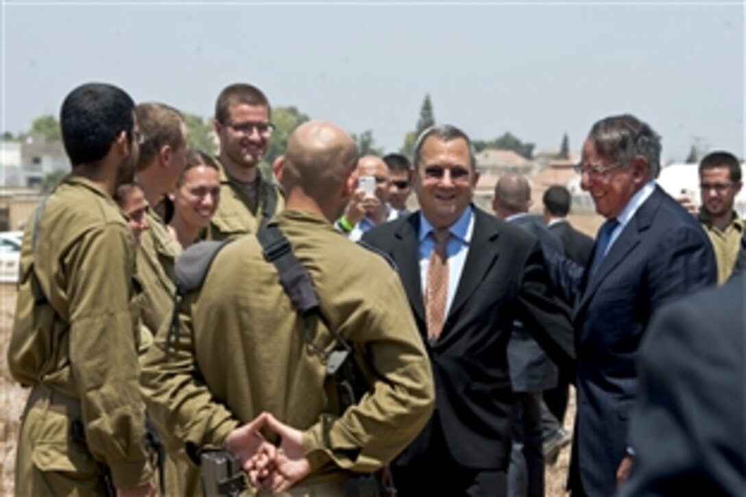 U.S. Defense Secretary Leon E. Panetta and Israeli Defense Minister Ehud Barak speak with Israeli soldiers at an Iron Dome anti-missile site in Ashkelon, Israel, Aug. 1, 2012. Panetta is on a five-day trip to the region to meet with leaders in Tunisia, Egypt, Israel and Jordan.