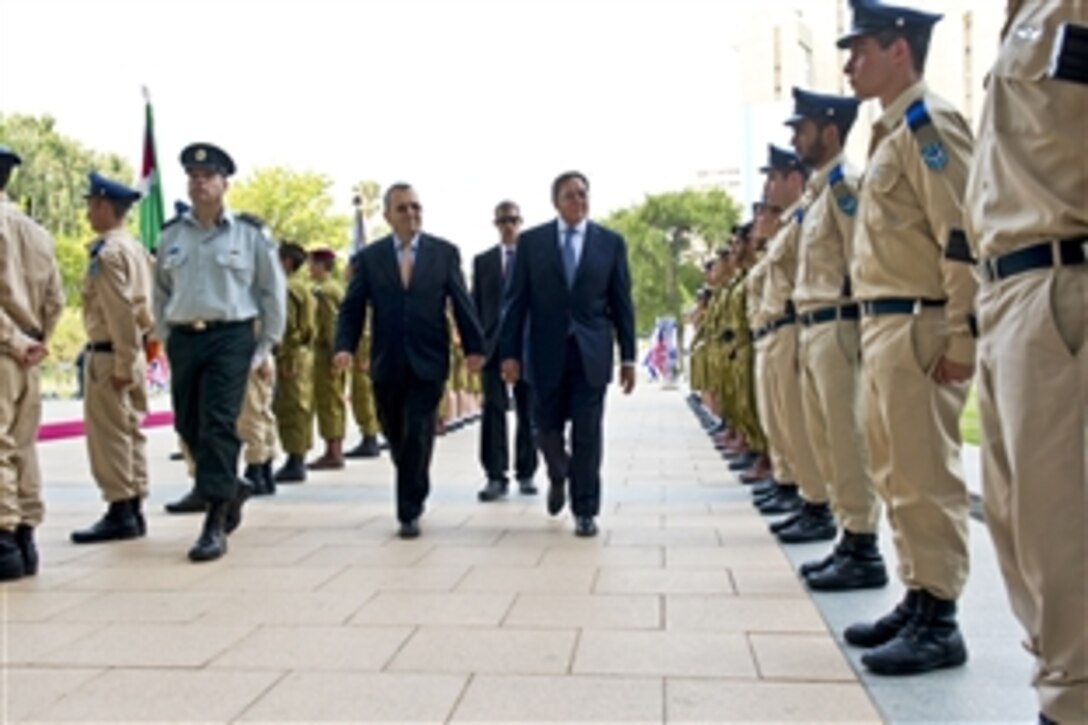 Israeli Defense Minister Ehud Barak leads U.S. Defense Secretary Leon E. Panetta through an honor cordon in Tel Aviv, Israel, Aug. 1, 2012. Panetta is on a five-day trip to the region to meet with leaders in Tunisia, Egypt, Israel and Jordan.