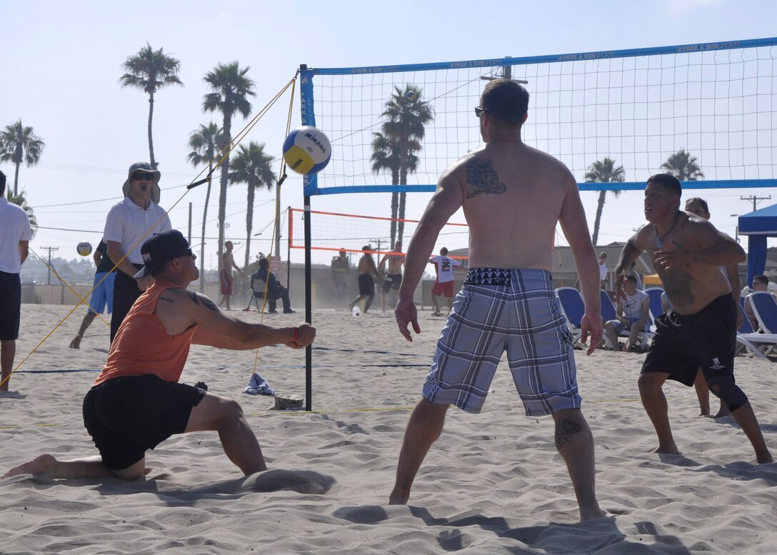 Members of "Team Heavy Hitters" from Wounded Warrior Battalion - West play volleyball during the Commanding Generals Cup's Beach Volleyball Tournament at Camp Pendleton's Del Mar Beach, Aug. 1.