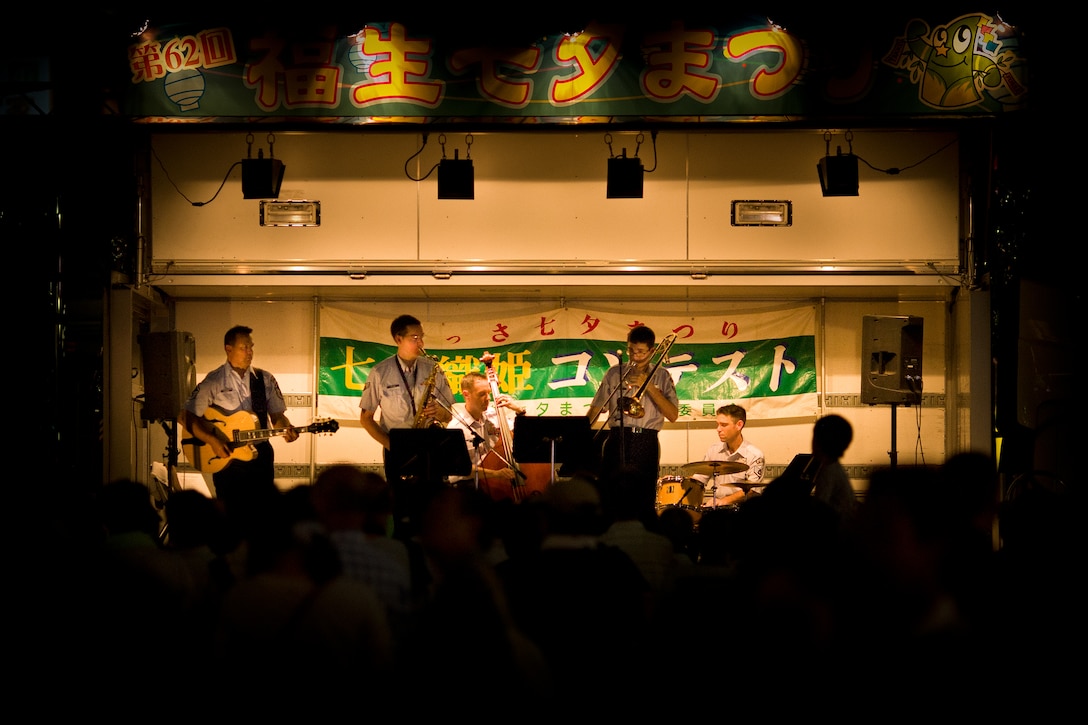 FUSSA, Japan -- Final Approach, Band of the Pacific-Asia jazz group, performs for a large crowd at the Tanabata Festival, Fussa, Japan, Aug. 2, 2012. The audience lined the front guard rail getting as close as possible to the band. (U.S. Air Force photo/Staff Sgt. Josh Voyles)