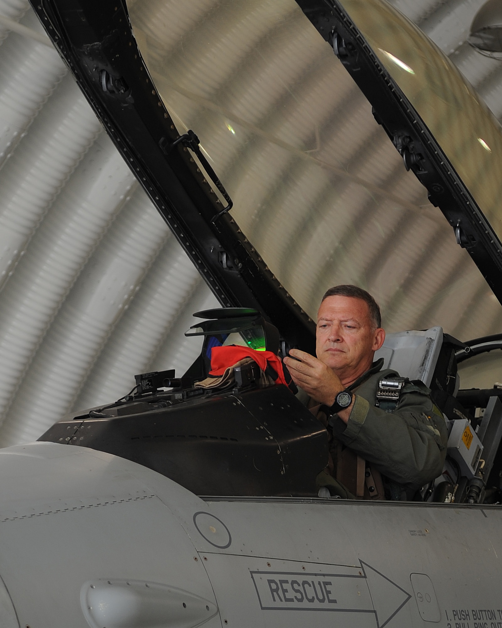 Gen. Gary North, Pacific Air Forces commander, performs pre-flight preparations before a flight at Kunsan Air Base, Republic of Korea, July 17, 2012. This flight was one of four flights that the general participated in during his final visit to Kunsan before his upcoming retirement after 36 years of service. (U.S. Air Force photo/Staff Sgt. Jonathan Fowler)