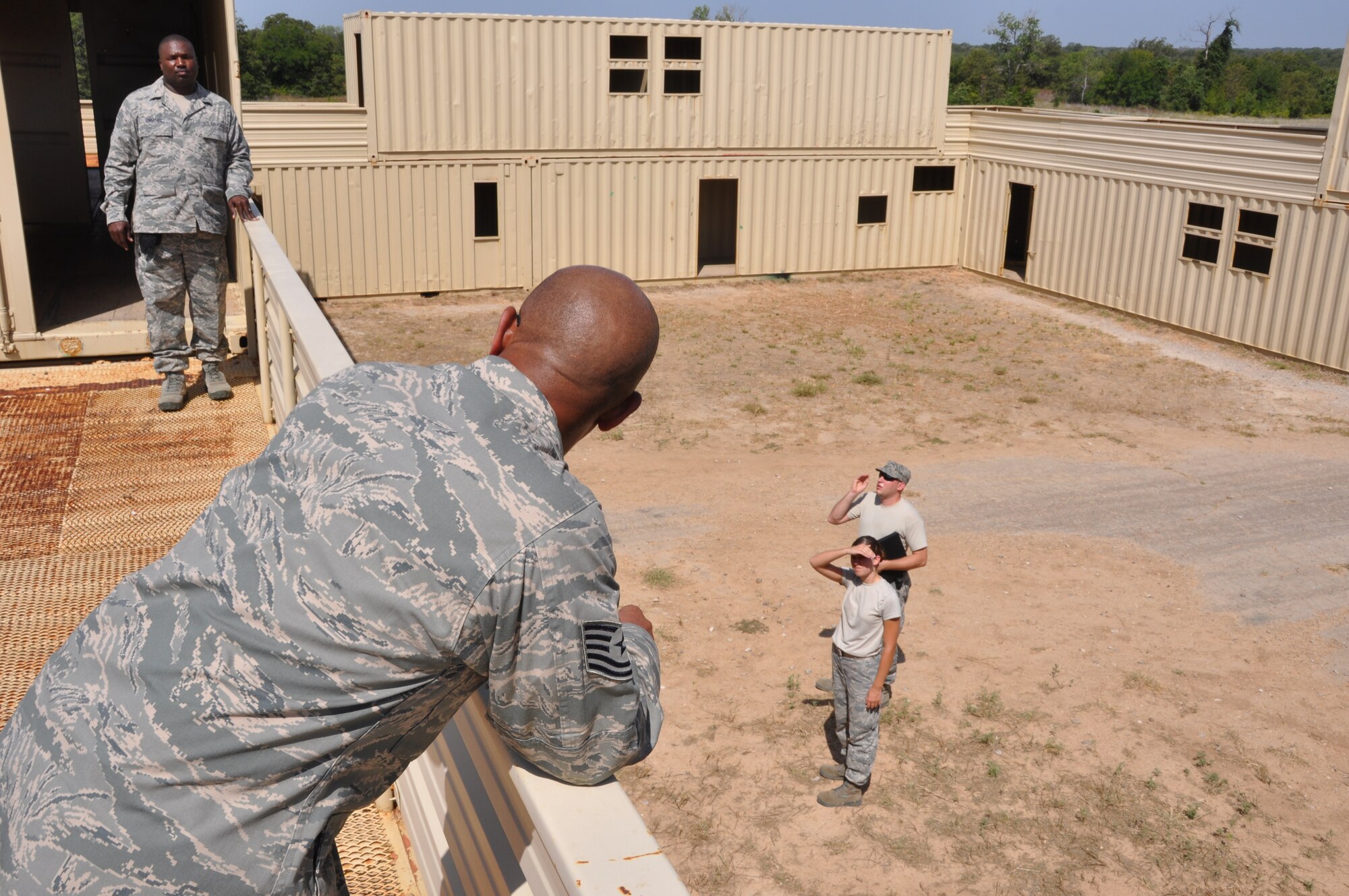 Members from the 301st Civil Engineer Squadron explored this facility made of conex storage containers looking for hidden cones and improvised explosive devices during their land navigation course at Fort Wolters Army National Guard Facility, Monday, July 23. (U.S. Air Force photo/SrA Jeremy Roman)