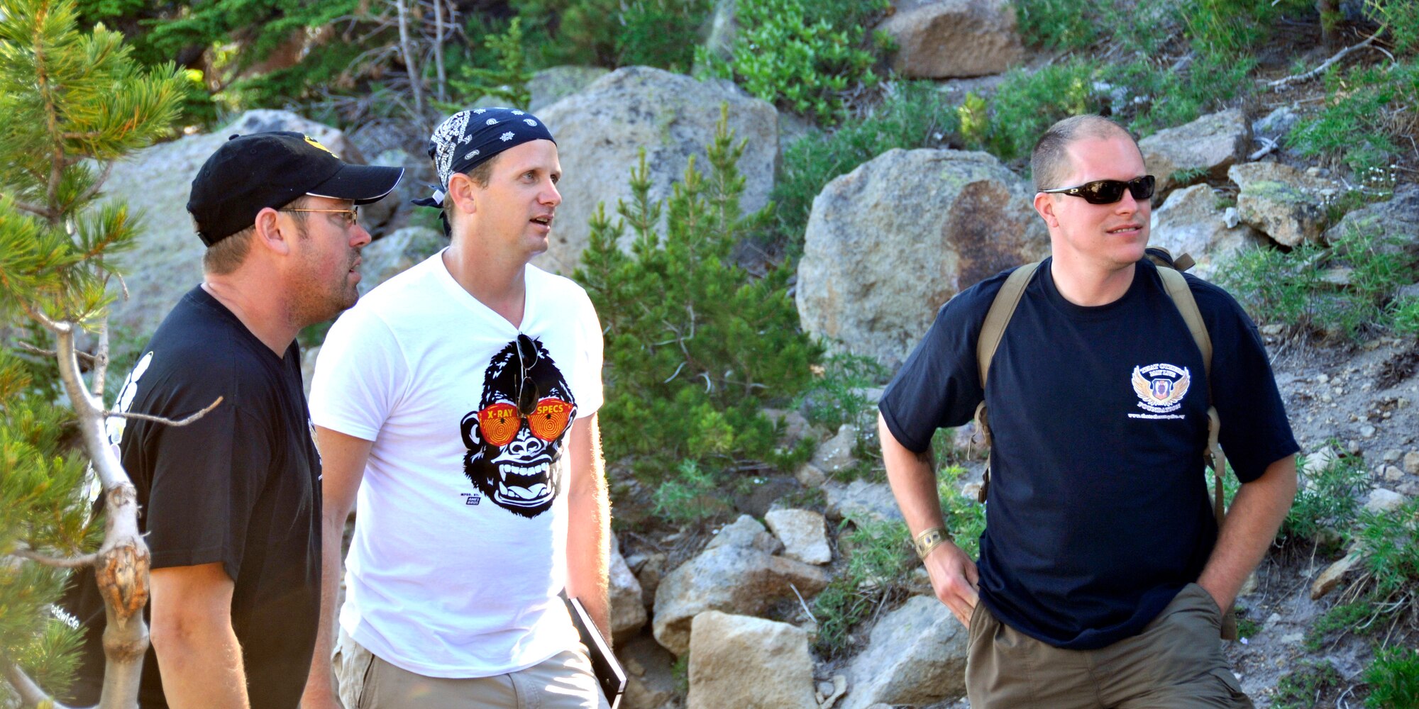 Wounded Angels, from left, Master Sgt. Frankie X. Reilly, Staff Sgts. Scott Bilyeu and Jimmy Settle took a break during a hike on Mount Hood, Ore. The three participated in a weeklong healing retreat on Mount Hood that was geared to connect injured Rescue Airmen July 22. (U.S. Air Force photo/Tech Sgt. Peter Dean)