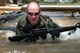 Master Sgt. Matt Smith, 3rd Combat Communications Group, Combat Readiness School commandant, demonstrates movement techniques on the Individual Movement Course. The 3rd CCG completed its final class recently. (Air Force photo by Micah Garbarino)