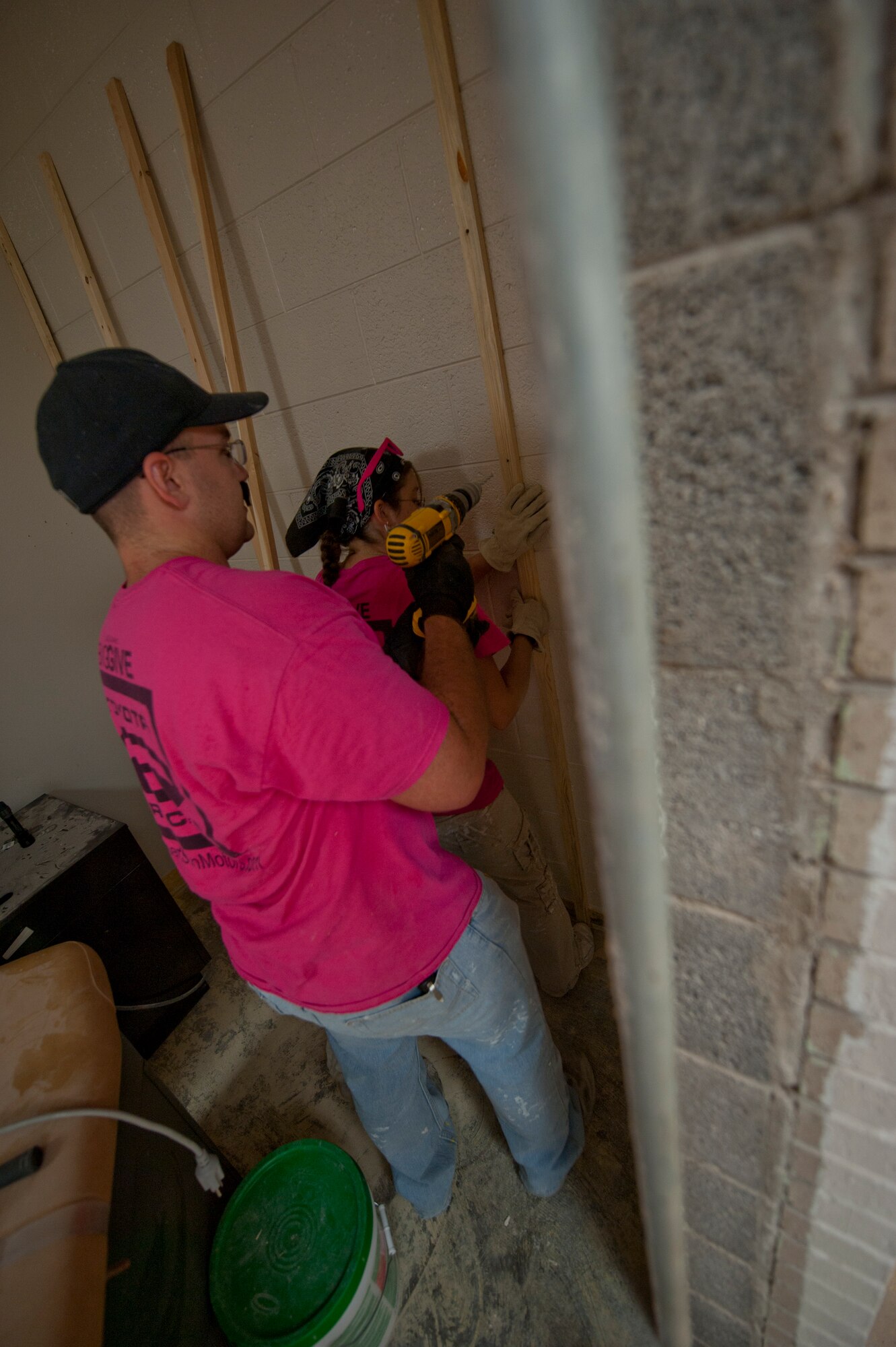A member of the Team Mudslingers Big Give team from Holloman Air Force Base, N.M., reinforces a wall in the Alamogordo, N.M., Medical Center July 21. Holloman AFB’s fifth annual Big Give event is a competition to give back to the Otero County community. Throughout the course of the competition, each Big Give team picks a project or way to give back to the community, and is judged on effort, enthusiasm, execution and impact made on the recipients. (U.S. Air Force photo by Airman 1st Class Daniel E. Liddicoet/Released)

