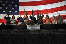 The official party of a Dining-In event raise their glasses in a toast to the mess beginning the event’s proceedings.  Malmstrom will be holding a Combat Dining-In for all active-duty military members in the 3-Bay Hangar on Aug. 17.  (U.S. Air Force photo/John Turner)