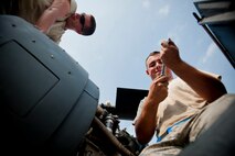 U.S. Air Force Airman 1st Class Errol Crossman, 723d Aircraft Maintenance Squadron crew chief, left, and Senior Airman Jason Conner, 41st Helicopter Maintenance Unit aerospace propulsion journeyman, finish the installation of an HH-60G Pave Hawk engine inlet July 31, 2012, at Moody Air Force Base, Ga. The process was a team effort from crew chiefs, and aircraft engine and hydraulic specialists. (U.S. Air Force photo by Staff Sgt. Jamal D. Sutter/Released) 