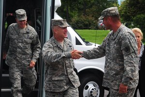 U.S. Air Force Maj. Gen. Lawrence Wells, 9th Air Force commander, greets U.S. Army Col. Thomas Wetherington, 733rd Mission Support Group commander, during a tour at Fort Eustis Va., Aug. 1, 2012. Wells visited Joint Base Langley-Eustis to evaluate the well-being of the personnel. (U.S. Air Force photo by Staff Sgt. Ashley Hawkins/Released)