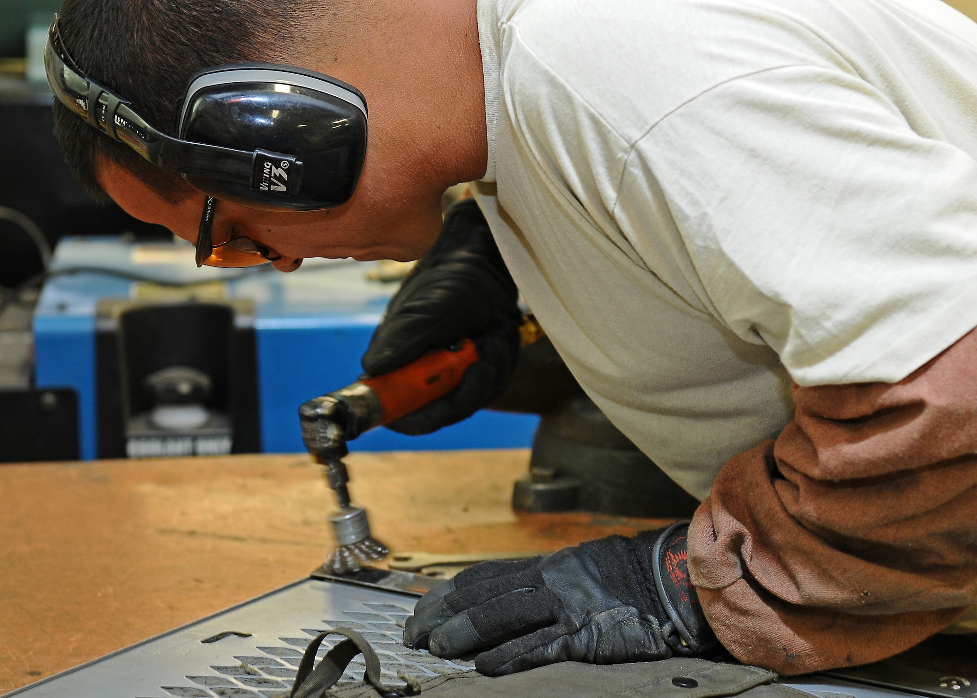 Tech. Sgt. Jesse Swiderek, 31st Maintenance Squadron aircraft metals technology craftsmen,, prepares a ground equipment panel for welding July 31, at Aviano Air base, Italy. Swiderek received $10,000 from a submission to the Innovative Development through Employee Awareness program, which is projected to save his unit more than $200,000 annually.(U.S. Air Force photo/Staff Sgt. Ryan Whitney)