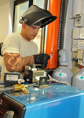 Tech. Sgt. Jesse Swiderek, 31st Maintenance Squadron aircraft metals technology craftsmen, checks a gas tank prior to welding a ground equipment panel July 31, at Aviano Air base, Italy. Swiderek proposed a workcenter change to the Innovative Development through Employee Awareness program regarding the welding of support brackets in aircraft fuel tanks, and received a $10,000 reward when his proposal was accepted.(U.S. Air Force photo/Staff Sgt. Ryan Whitney)