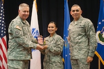 Col. Robert Bridgford, 502nd Air Base Wing vice commander and Joint Base San Antonio deputy commander, accompanied by Chief Master Sgt. Jose LugoSantiago, 502nd ABW and JBSA command chief master sergeant, give Staff Sgt. Maribelle Hernandez, 802nd Mission Support Group manpower analyst, the NCO of the Quarter award during the 502nd ABW 2nd Quarter Awards at the Randolph Kendrick Club Aug. 1.
(U.S. photo by Benjamin Faske)
