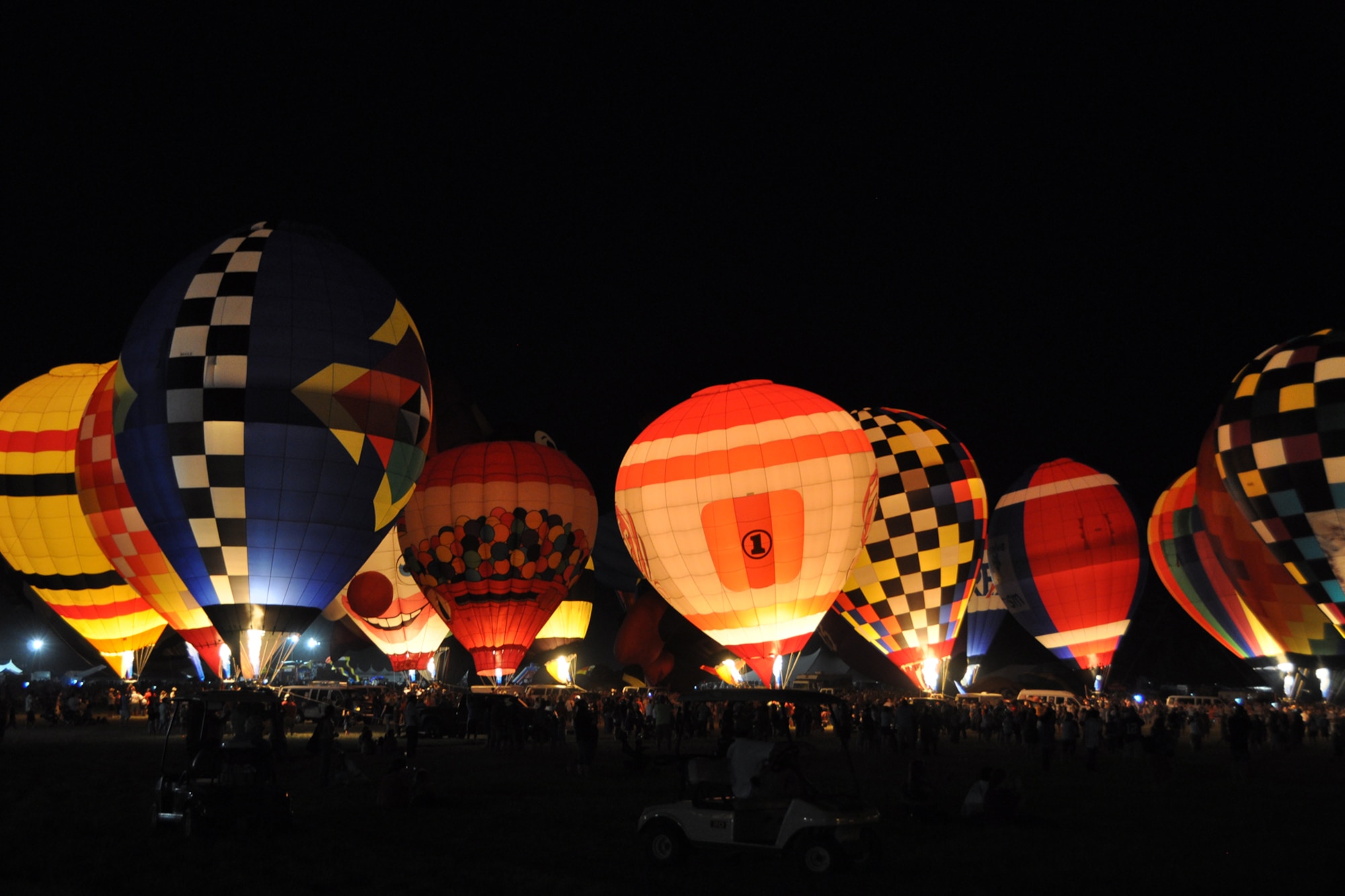 Thousands of people enjoy a spectacular display of color during the Balloon Glow at the Great Texas Balloon Race 2012, at the East Texas Regional Airport in Longview, Texas, July 28, 2012. For the first time in the 35-year history of the event, the U.S. National Championships were held in conjunction with the annual event. (U.S. Air Force photo by Master Sgt. Jeff Walston)