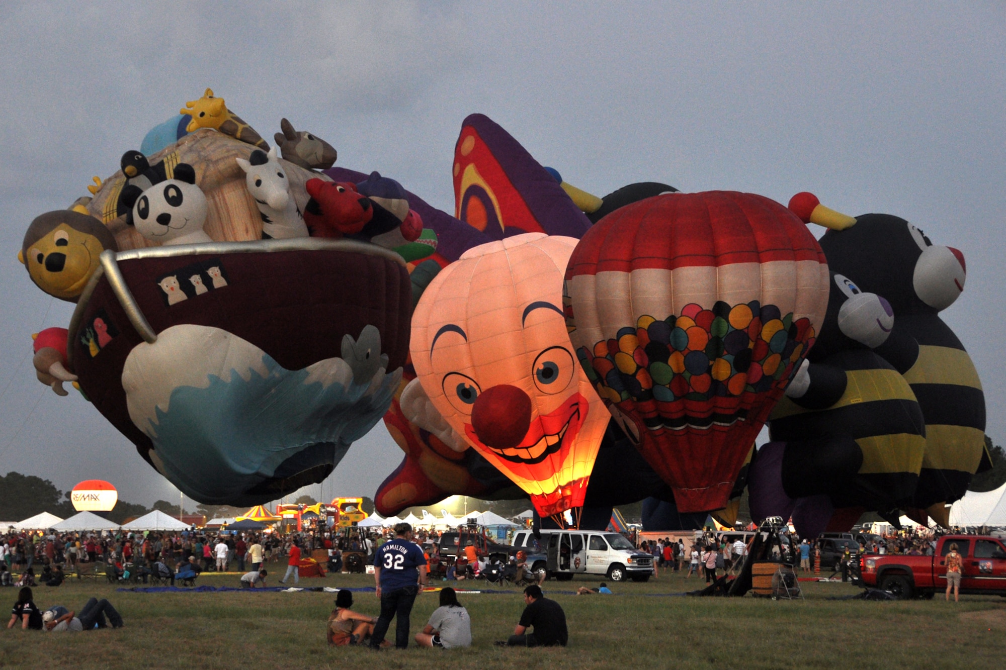 Spectators watch the Special Shapes Spectacular event at the Great Texas Balloon Race 2012, at the East Texas Regional Airport in Longview, Texas, July 28, 2012. For the first time in the 35-year history of the event, the U.S. National Championships were held in conjunction with the annual event. (U.S. Air Force photo by Master Sgt. Jeff Walston)