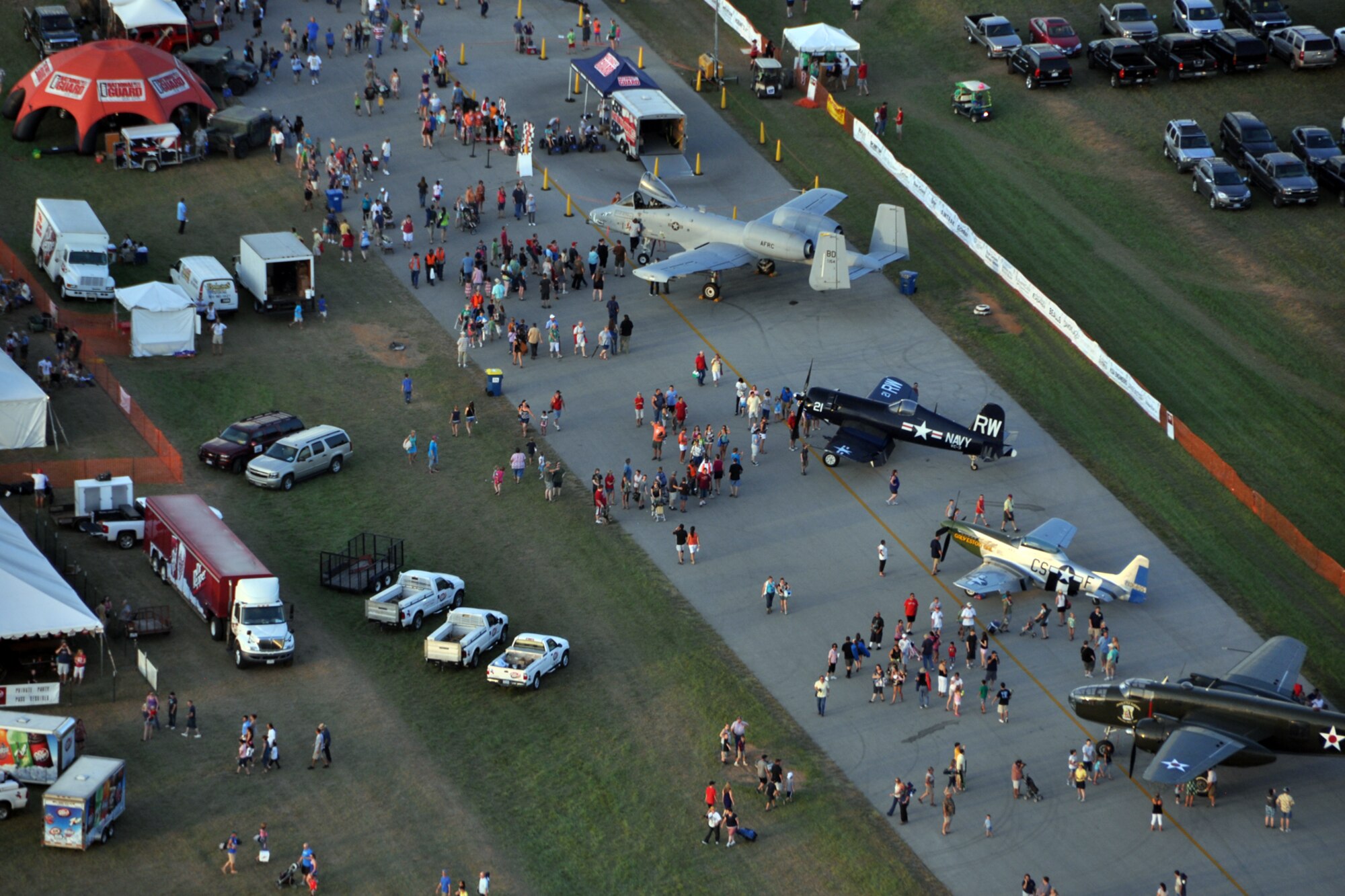 Crowds gather around several military displays at the 35th Annual Great Texas Balloon Race 2012, at the East Texas Regional Airport in Longview, Texas, July 28, 2012. For the first time in the 35-year history of the event, the U.S. National Championships were held in conjunction with the annual event. (U.S. Air Force photo by Master Sgt. Jeff Walston)