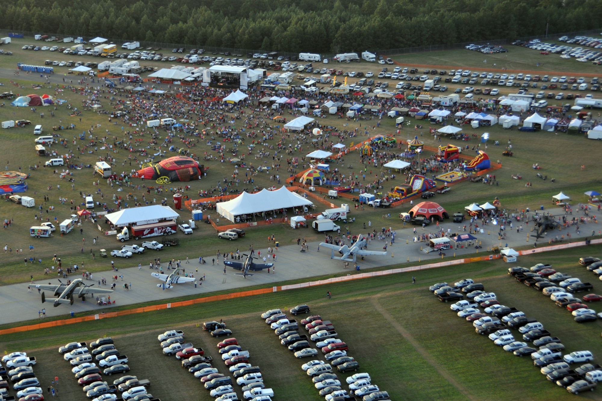 Thousands of spectators start gathering during the 35th Annual Great Texas Balloon Race at the East Texas Regional Airport in Longview, Texas, July 28, 2012. For the first time in the 35-year history of the event, the U.S. National Championships were held in conjunction with the annual event. (U.S. Air Force photo by Master Sgt. Jeff Walston)