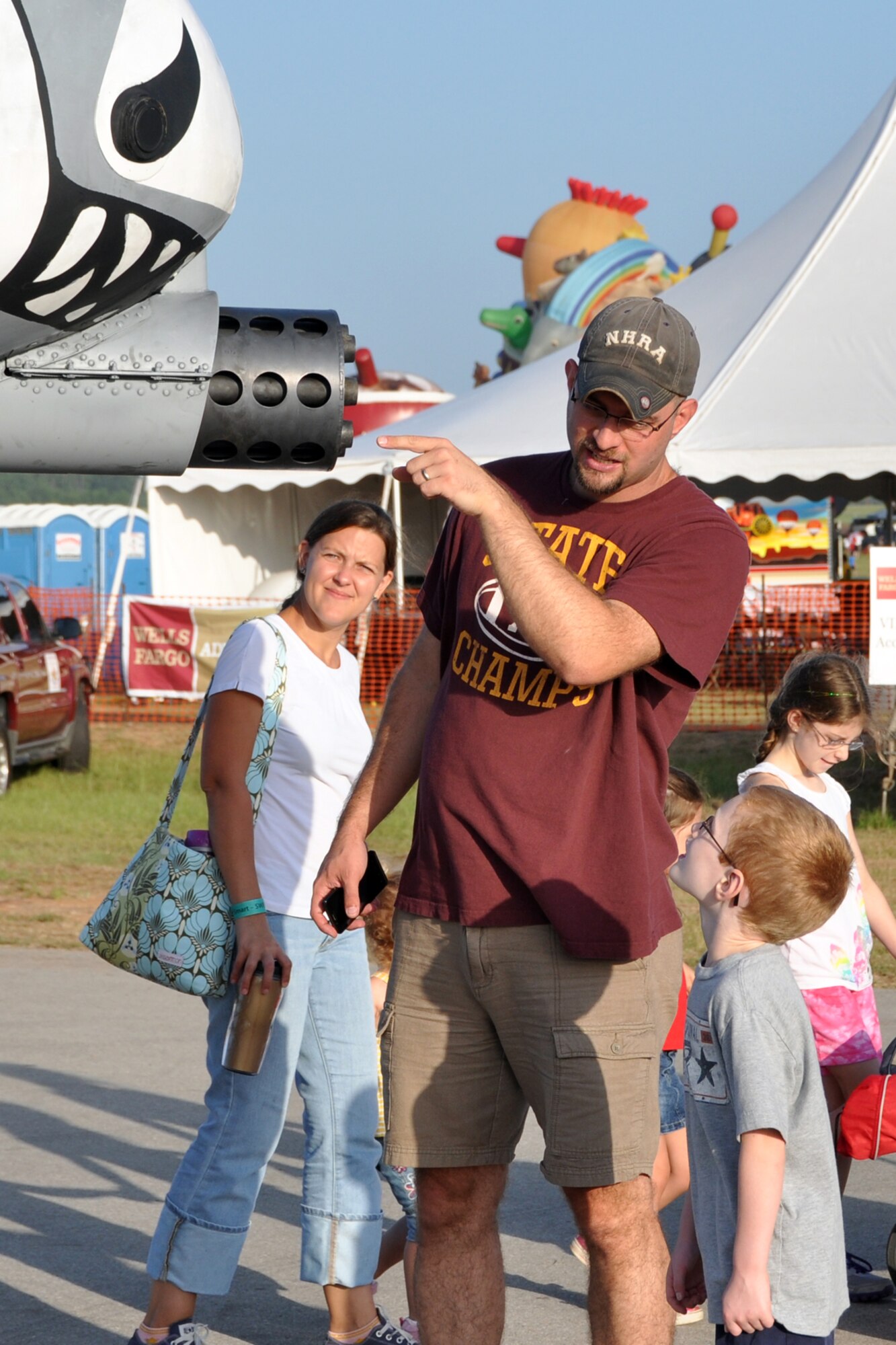 Chuck Goodson explains the concept of “a big gun with big bullets,” to his son Kurt at the Great Texas Balloon Race 2012, at the East Texas Regional Airport in Longview, Texas, July 28, 2012. An A-10 Thunderbolt II from the 47th Fighter Squadron, 917th Fighter Group, at Barksdale Air Force Base, La., was one of several military displays at the event. Maj. Jason Cobb, a pilot assigned to the 47 FS piloted the jet to the event and was on hand to answer questions from the public. (U.S. Air Force photo by Master Sgt. Jeff Walston)    