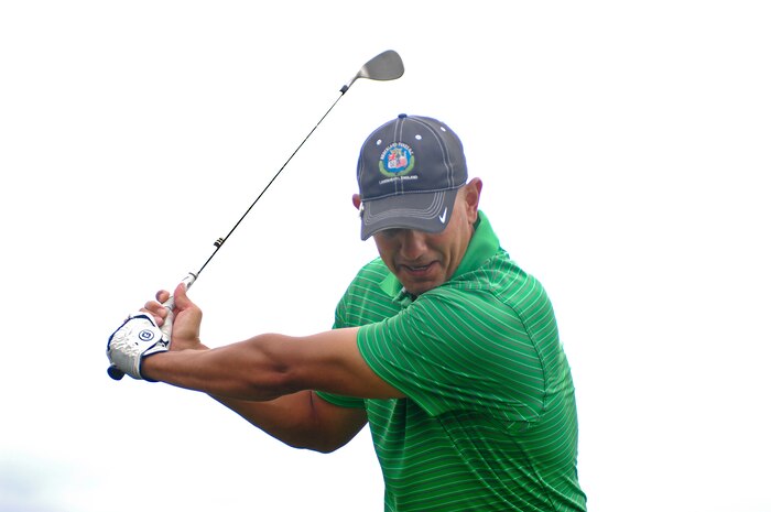 U.S. Air Force Master Sgt. Alex Ackley, a fire emergency services accreditation manager with the 99th Civil Engineer Squadron, tees off at the Sunrise Vista Golf Course July 31, 2012 at Nellis Air Force Base, Nev. Ackley made a hole in one on hole number eight on the Sunrise Vista Golf Course's Eagle Course, a 104 yard drive, on July 24, 2012, against the 99th Force Support Squadron enabling the 99th CES a win during the intramural golf playoffs. The 820th Red Horse Squadron will play the winner of the semi-final match between the 99th Medical Group and the 432nd Operations Group in the finals being held on Aug. 9, 2012.  (U.S. Air Force photo by Master Sgt. David Miller)