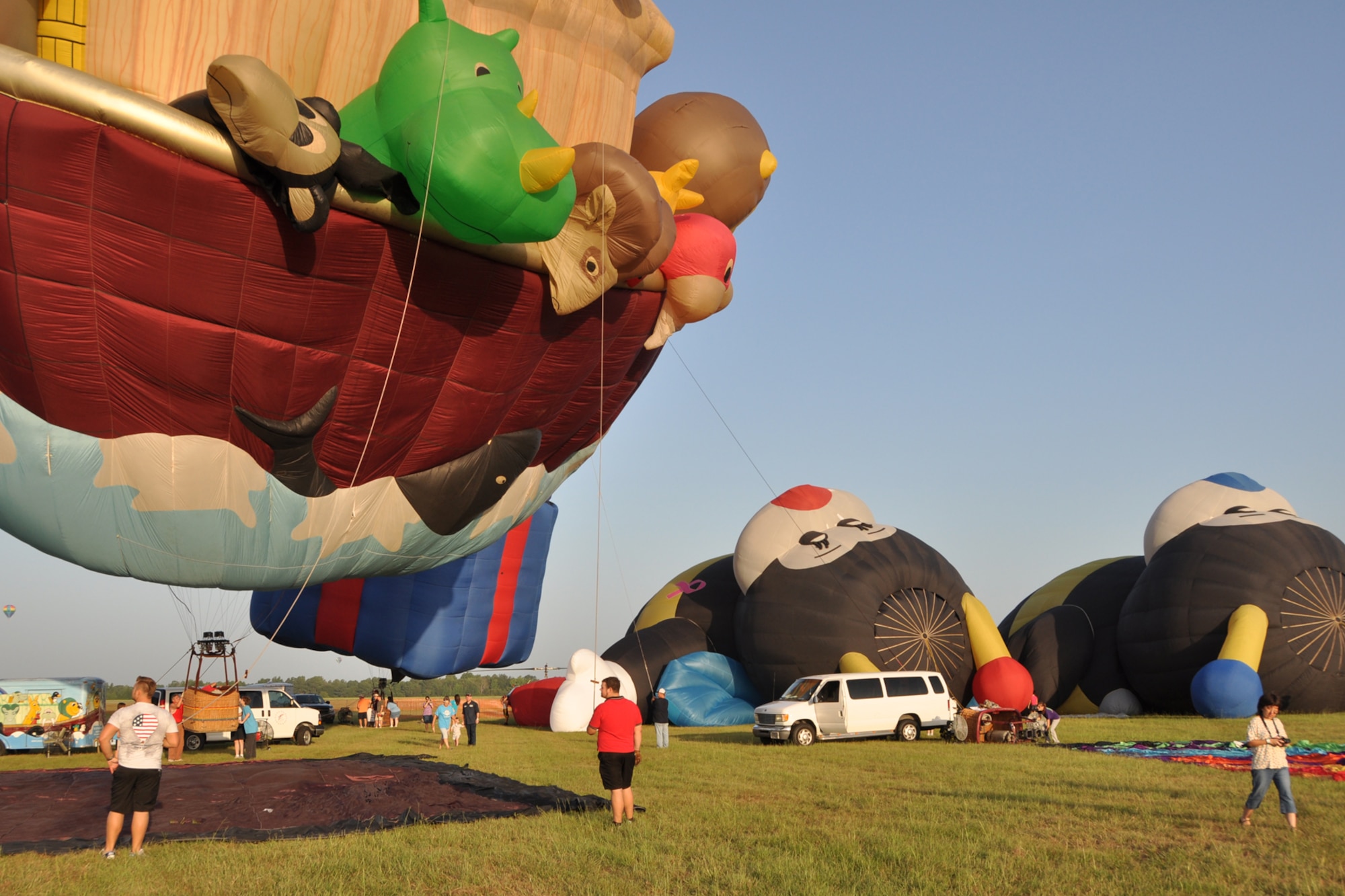 Inflated animals appear to watch balloon crews as they prepare to launch a “Special Shapes” balloon during the Great Texas Balloon Race 2012, at the East Texas Regional Airport in Longview, Texas, July 28, 2012. For the first time in the 35-year history of the event, the U.S. National Championships were held in conjunction with the annual event. (U.S. Air Force photo by Master Sgt. Jeff Walston)