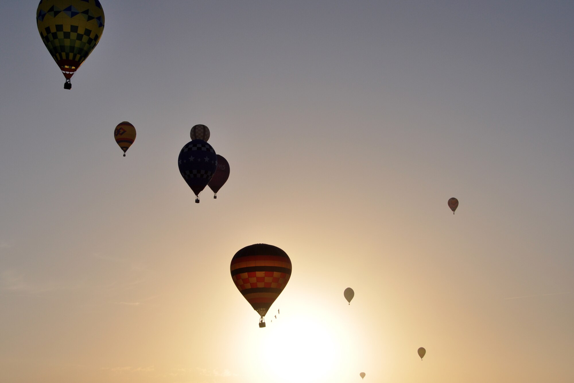 A number of hot air balloons head off to pick-up sites after competing in the Ring Toss Competition and the other Navigational Tasks at the Great Texas Balloon Race 2012, at the East Texas Regional Airport in Longview, Texas, July 28, 2012. For the first time in the 35-year history of the event, the U.S. National Championships were held in conjunction with the annual event. (U.S. Air Force photo by Master Sgt. Jeff Walston)    
