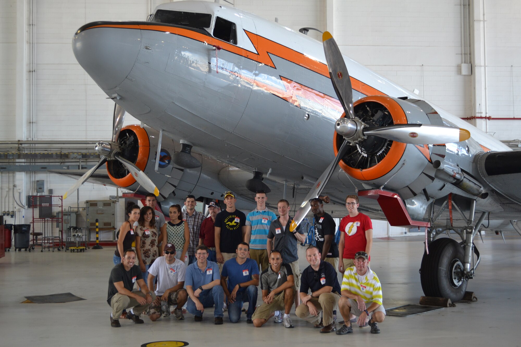 Red River Airlift and Tanker Association members and 97th Air Mobility Wing personnel pose in front of a Douglas DC-3 during a tour of the Mike Monroney Aeronautical Center in Oklahoma City. The DC-3 is one of the original flight inspection aircraft.  The ATA is a non-profit professional organization dedicated to the continuous improvement of air mobility forces. 