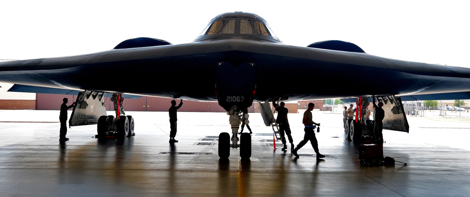 WHITEMAN AIR FORCE BASE, Mo. -- Crew chiefs from the 509th Aircraft Maintenance Squadron and 131st Bomb Wing perform a phase inspection on a B-2 Spirit July 12. Every 1000 flight hours the B-2 must be "phased" in search of any discrepancies that could cause major damage. (U.S. Air Force photo/Senior Airman Nick Wilson)