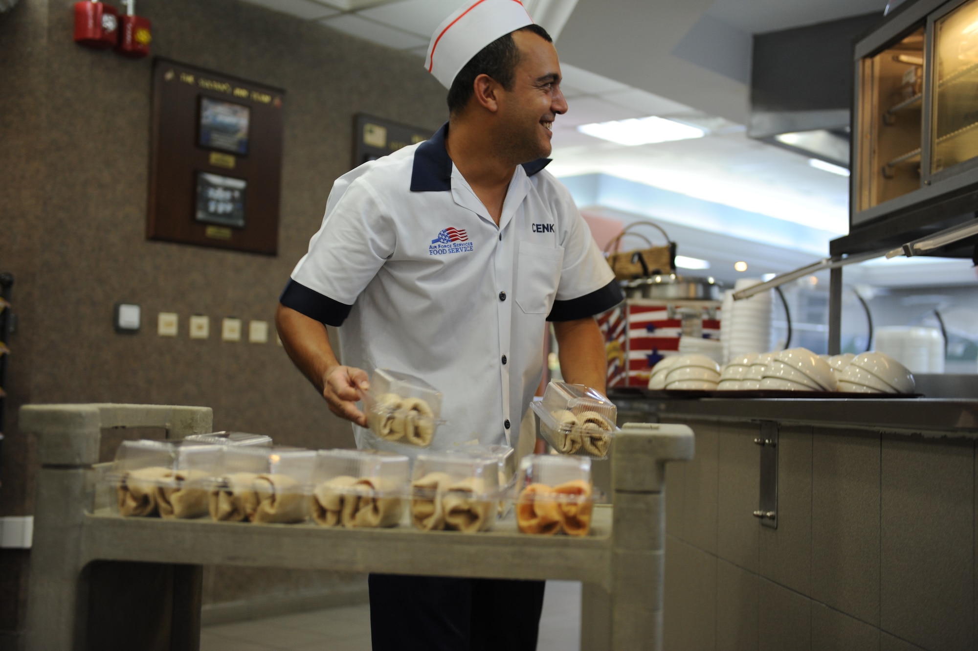 Cenk Kor, 39th Force Support Squadron apprentice cook, puts a variety of pre-made sandwiches away in preparation for lunch July 27, 2012, at the Sultan's Inn Dining Facility at Incirlik Air Base, Turkey. The facility offers a main line, short order line, and a variety of made-to-order foods such as sandwiches and chicken at lunch.  (U.S. Air Force photo by Senior Airman William A. O'Brien/Released) 